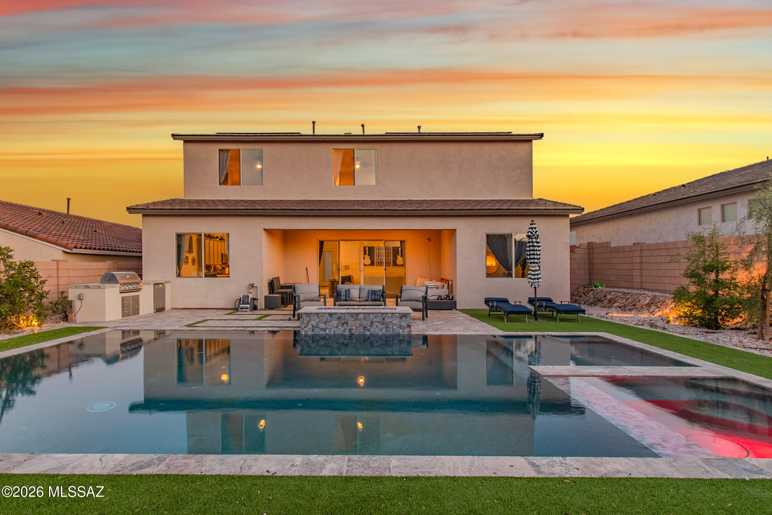 This yard is ready for your desert mornings, summer BBQ's, & evening sunsets! This stunning, nearly new 5-bedroom + den home just under 3,000 sf with a 3 car tandem garage in a sought after Vail community already has what builders can't give you-a spectacular resort-style backyard oasis! Enjoy the sparkling resort-style pool & spa and built in grill, entertain on the artisan paver patio, & enjoy lush turf that stays magazine-worthy year-round. Inside, the oversized open & light-filled floor plan impresses with modern finishes and space for every need-including a loft & home office or flex room. Everything is done and done beautifully. Just move in and start living the Arizona luxury lifestyle you deserve. Schedule your private showing today before someone else claims this paradise. With multiple bathrooms and flexible living spaces, this home provides comfort and versatility for a variety of lifestyles. The primary suite serves as a private retreat, while additional rooms can be used for bedrooms, office space, or guest accommodations.
Situated on an approximately 8,838 sq ft lot, the property offers plenty of outdoor space with potential to customize your ideal backyard oasis. A 3-car garage provides ample parking and storage. Located in a growing area of Vail, this home offers a peaceful setting while still being within reach of shopping, dining, and top-rated schools. Don't miss the opportunity to own a beautifully built home in one of the area's most desirable communities.
