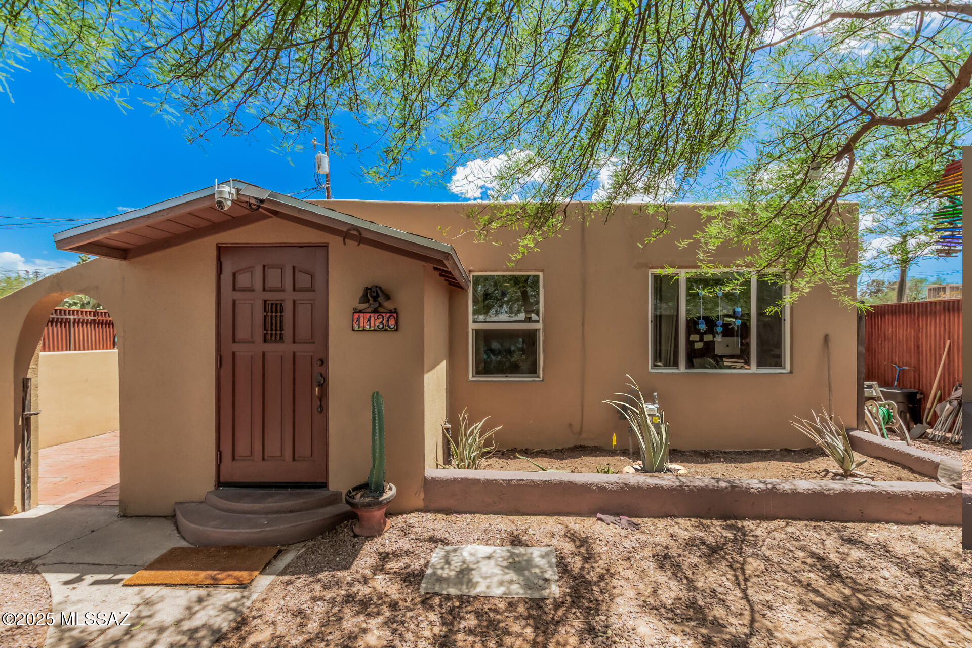 Beautifully upgraded & private masonry stucco home just over 1 mile from University of Arizona campus & Banner University Medical Center! Your family will make memories in this home, situated in a highly desirable neighborhood just feet from the Mountain Rd bike path to U of A Campus. This property also features a Detached Unit in back, plumbed for water & sewer to the foundation, that is suitable for renovation as a Guest House or Creative Studio. This home is also perfect for entertaining guests as it features: privacy fencing around home, ceramic tile flooring, updated kitchen, irrigation system, 2 fully remodeled baths, energy efficient masonry stucco construction w/ NEW energy-efficient dual pane windows, a newer HVAC system, updated electrical main. Come make this house your home!
