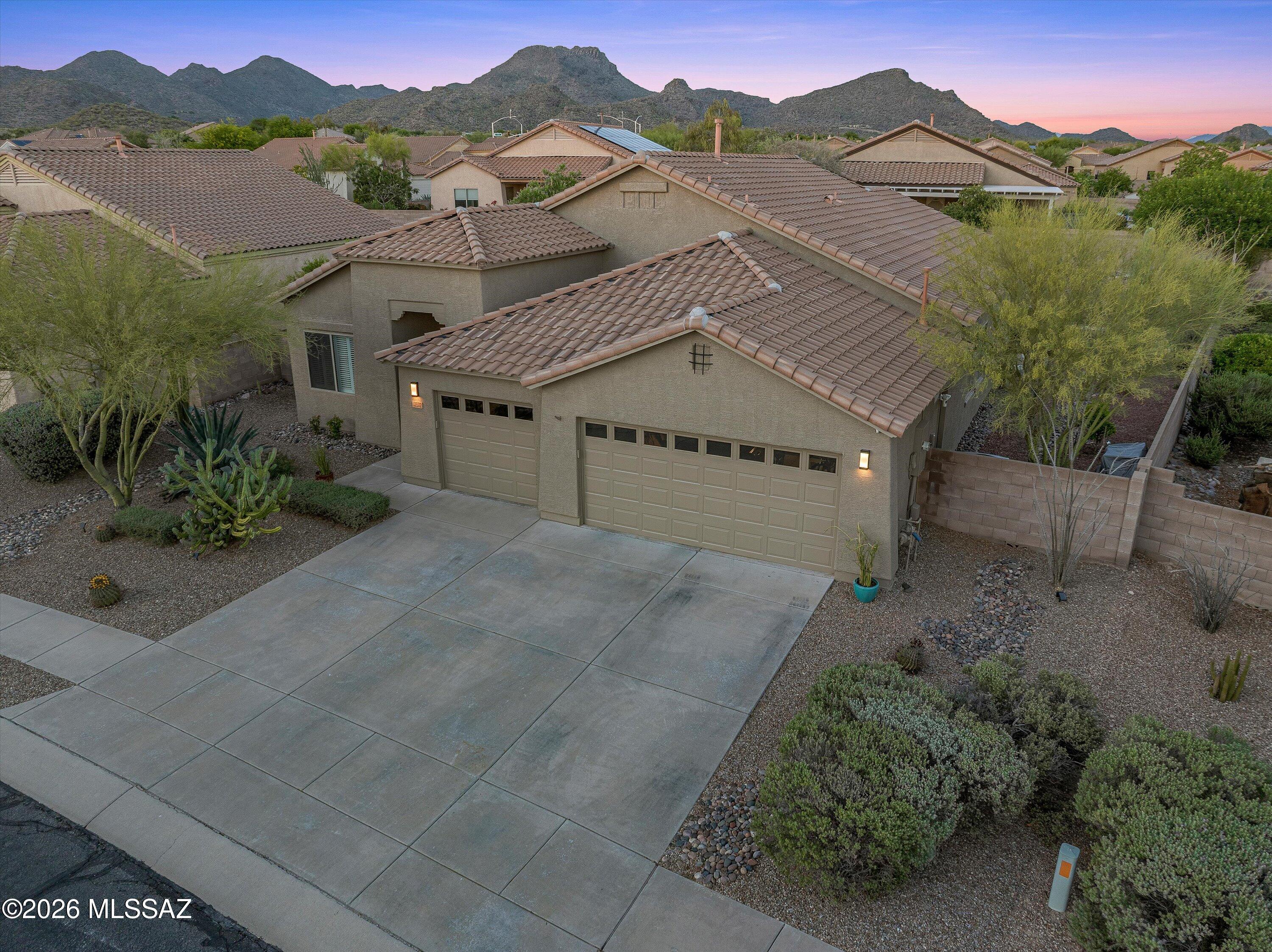 Pride of ownership shines in this single story, 3 bed/2 bath home in a sought-after Dove Mountain location. Inside you will find gorgeous LVT flooring in all the right places (and NEW carpet in the bedrooms), creating a clean and flowing upscale feel. Spacious floorplan offers flexible living spaces, an open kitchen design with granite island & desk area, all appliances and an abundance of cabinets, as well as a split bedroom floorplan for privacy. Outside is your very serene oasis, complete with mature landscaping, heated pool/spa, and a raised bed gardening area on almost a ¼ acre lot! The 3-car garage is the cherry on top, offering room for a workshop and all your toys! Close to shopping, restaurants, I-10 and much more, this one is the perfect MOVE-IN ready choice!
