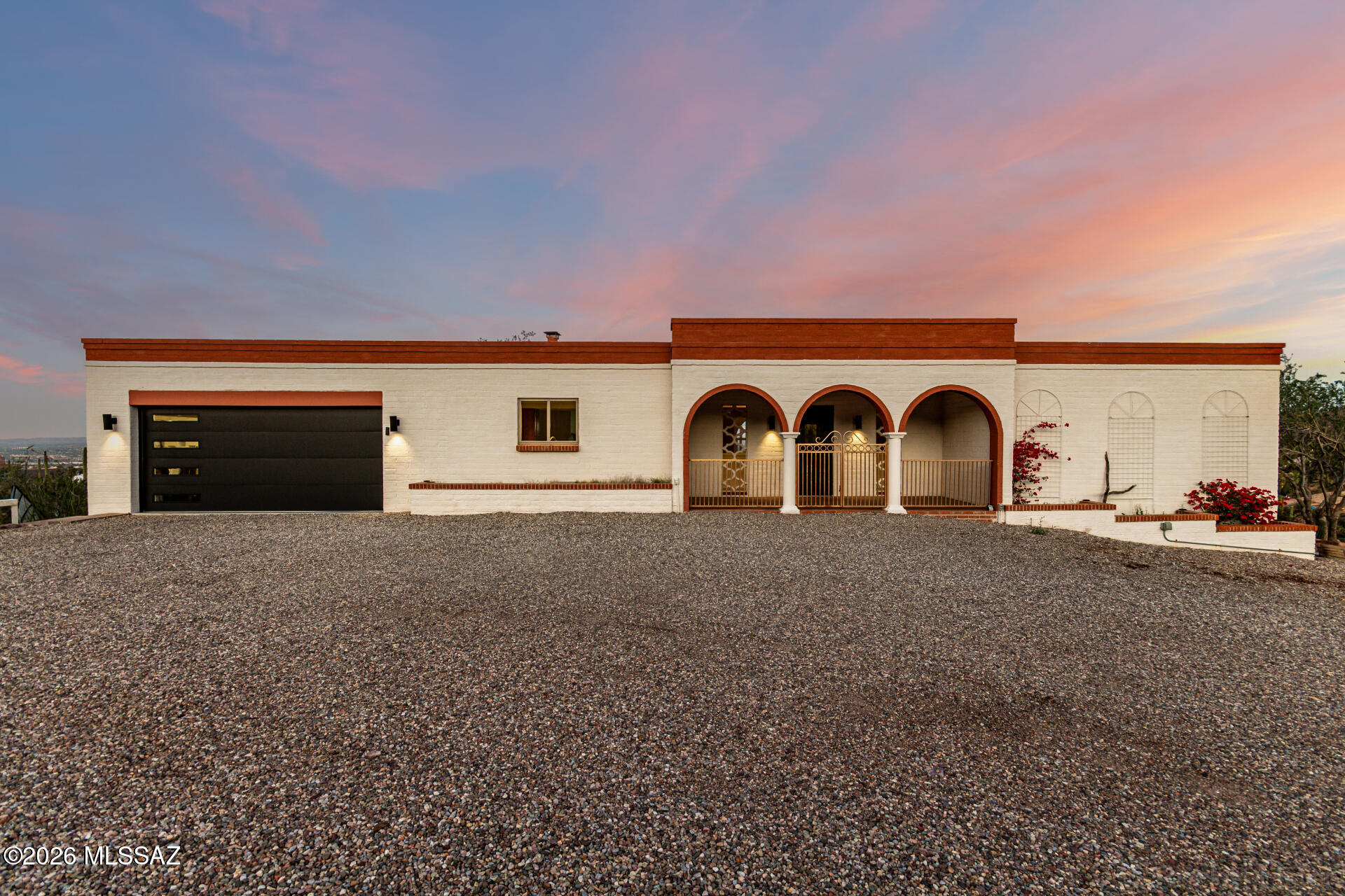 Perched on 1.03 acres of pristine Sonoran Desert, this exceptional west-side property offers breathtaking city views--from glowing sunsets to sparkling evening lights. With rare privacy and wide-open space, the possibilities are endless to create your dream outdoor retreat, add a pool or guest house, or simply enjoy the tranquility of desert living.

Inside, the home features a bright, comfortable layout designed to capture the surrounding desert and mountain views. Ideally located in desirable 85745 with easy access to hiking, downtown Tucson, shopping, and dining. With over an acre of Sonoran Desert, stunning views, and endless potential, this unique Gates Pass-area property offers the best of Tucson desert living. On over an acre of potential to make your dream home a reality. Homes with this kind of acreage and stunning city views are rare. Don't let this beauty pass you by!