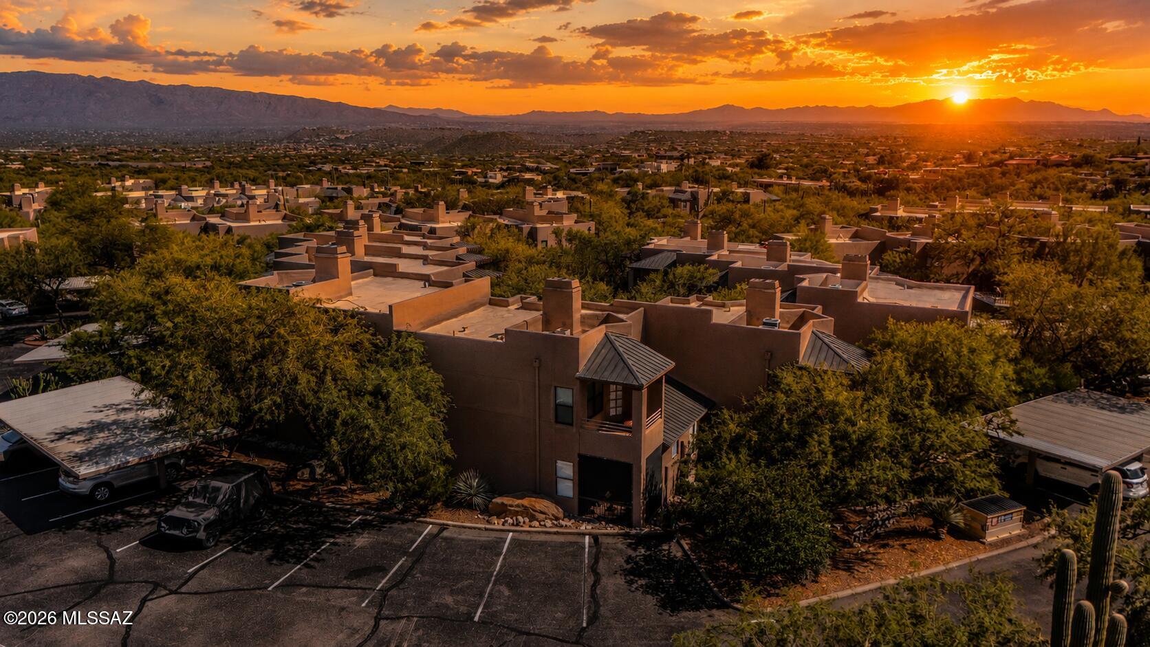 CONVEYS FULLY FURNISHED! Beautiful, updated, 1st floor condo with mountain views next to the Ventana trailhead and Ventana Lowes Spa and Resort. Location, location, location! This is the perfect way to own a lock and go vacation home, AirBnB rental or your own desert retreat. Updates include HVAC, appliances, water heater, primary bathroom, and more. This 2 bedroom, 2 bath condo is truly turn-key from the furniture to the kitchen utensils & linens. You just need to buy the groceries. The enclosed patio lets you enjoy the outside space year-round. Amenities include pool, spa/hot tub, recreation room, clubhouse, sports courts, and more.   This is the perfect place whether to call it home for yourself or for visitors to relax. There are no rental restrictions!
