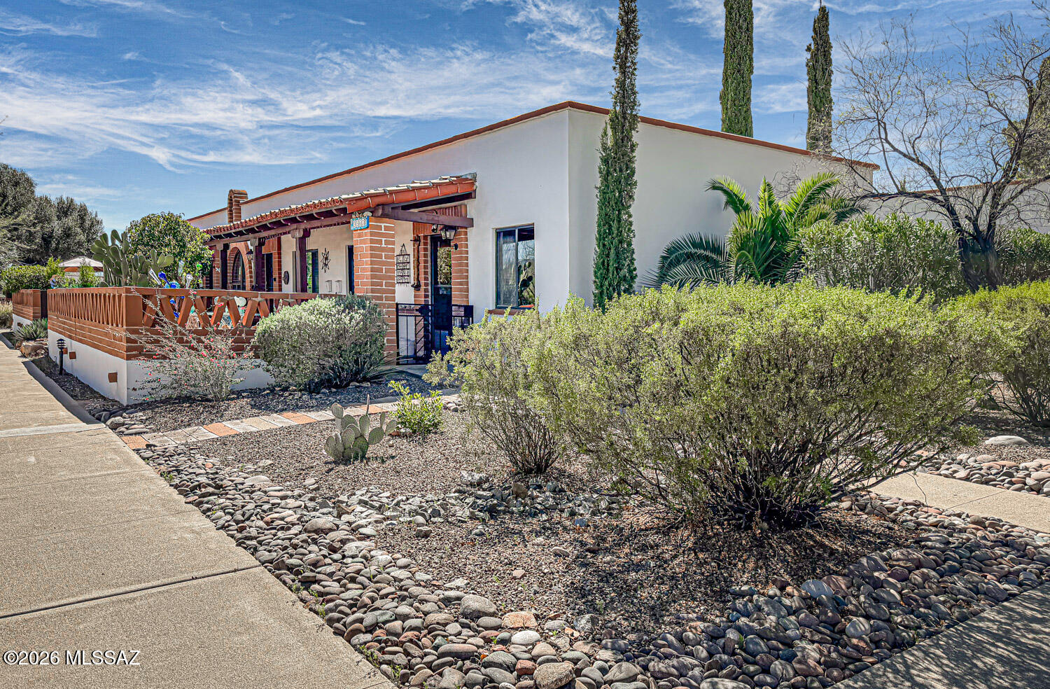 Step into this immaculate home and immediately feel the mid-century modern vibe, highlighted by clean lines and stylish leather and teak Scandanavian-inspired furnishings, which convey with the property-making this a rare turn-key opportunity.    The bright and functional kitchen features newer cabinetry, a full-size gas range, microwave and dishwasher.  Throughout the home you'll find  easy-care painted concrete that adds to the modern aesthetic, while the main bedroom features comfortable carpeting for a cozy retreat.  Step outside, to a back patio where a separate shed houses a washer and dryer, providing convenient laundry space and additional storage.   Plus you get an East facing front patio with some mountain views!   Come make this dream home yours!