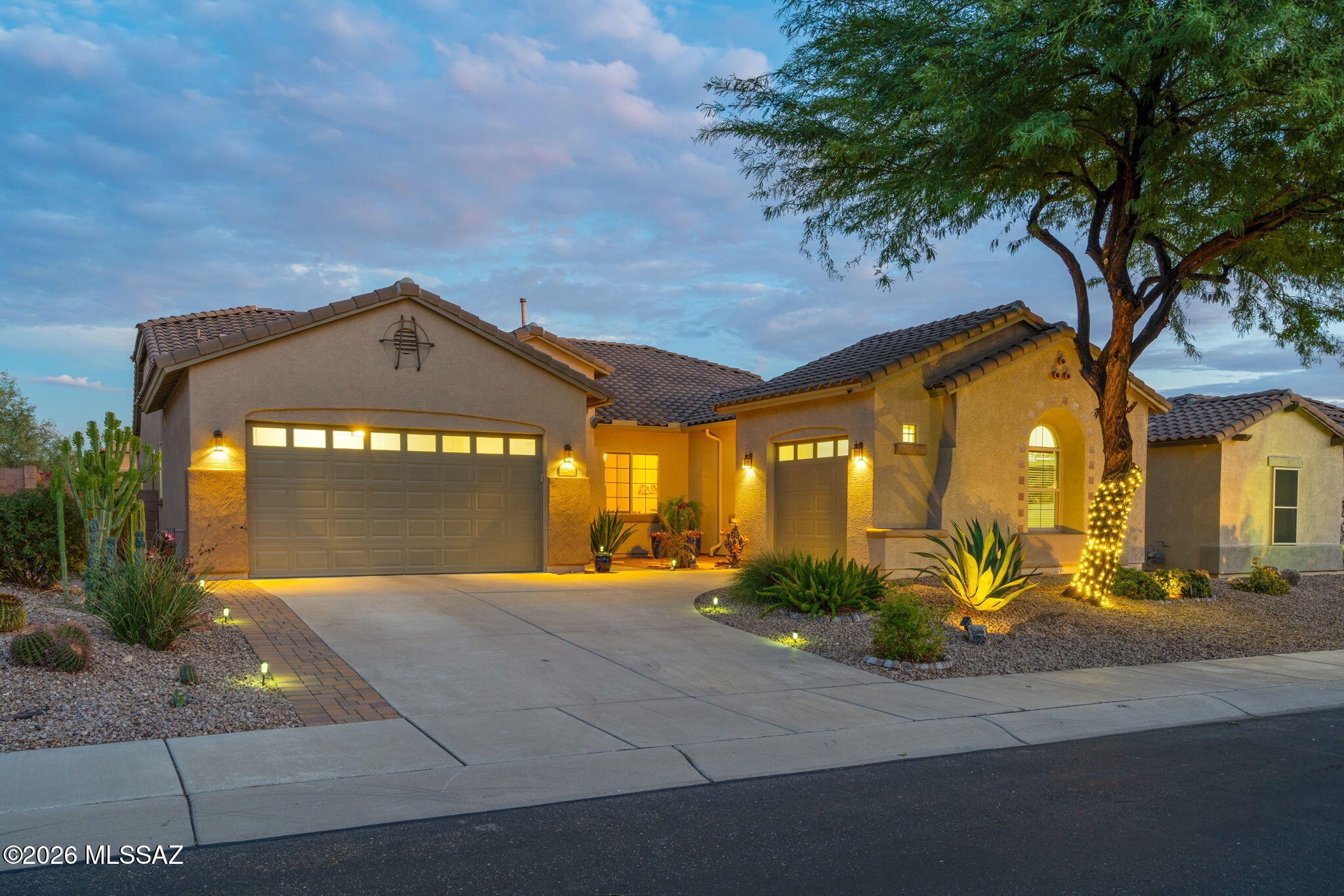 Desert living shines in this inviting 3-bedroom + den, 2.5-bath home, where mountain views and natural desert create a beautiful backdrop. The spacious kitchen offers generous cabinetry, expansive counters and a large island for easy gathering. Step outside to a private-feeling retreat with a heated pool and raised spa, generous patio space and open desert beyond the backyard. The primary suite offers its own relaxing retreat, complete with a soaking tub for unwinding at the end of the day. The 3-car garage provides ample space for a private workshop, extra storage or all your favorite toys. Envision yourself here, enjoying peaceful desert views, beautiful sunsets and the best of Tucson indoor-outdoor living.