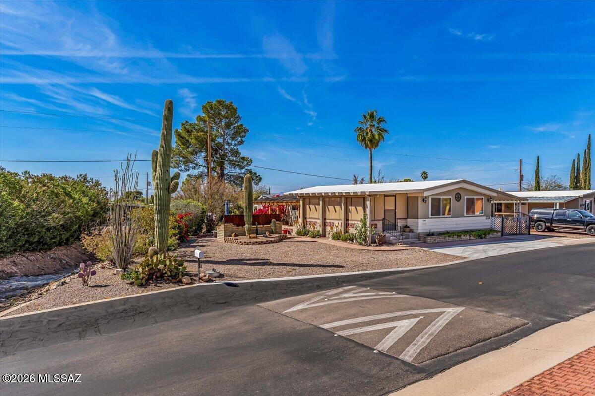 Freshly updated and move-in ready! This 2 bed, 2 bath home features all-new interior paint and a bright Arizona Room perfect for relaxing or entertaining. Situated on an extra-large lot alongside an arroyo, enjoy added privacy and stunning mountain views. The property includes three storage sheds for ample space and convenience. You own both the land and the home-no land lease! Community amenities offer a resort-style experience with golf, pickleball, tennis, pools, spa, recreation room, and a variety of clubs and activities. A wonderful opportunity to enjoy comfort, space, and an active lifestyle!
