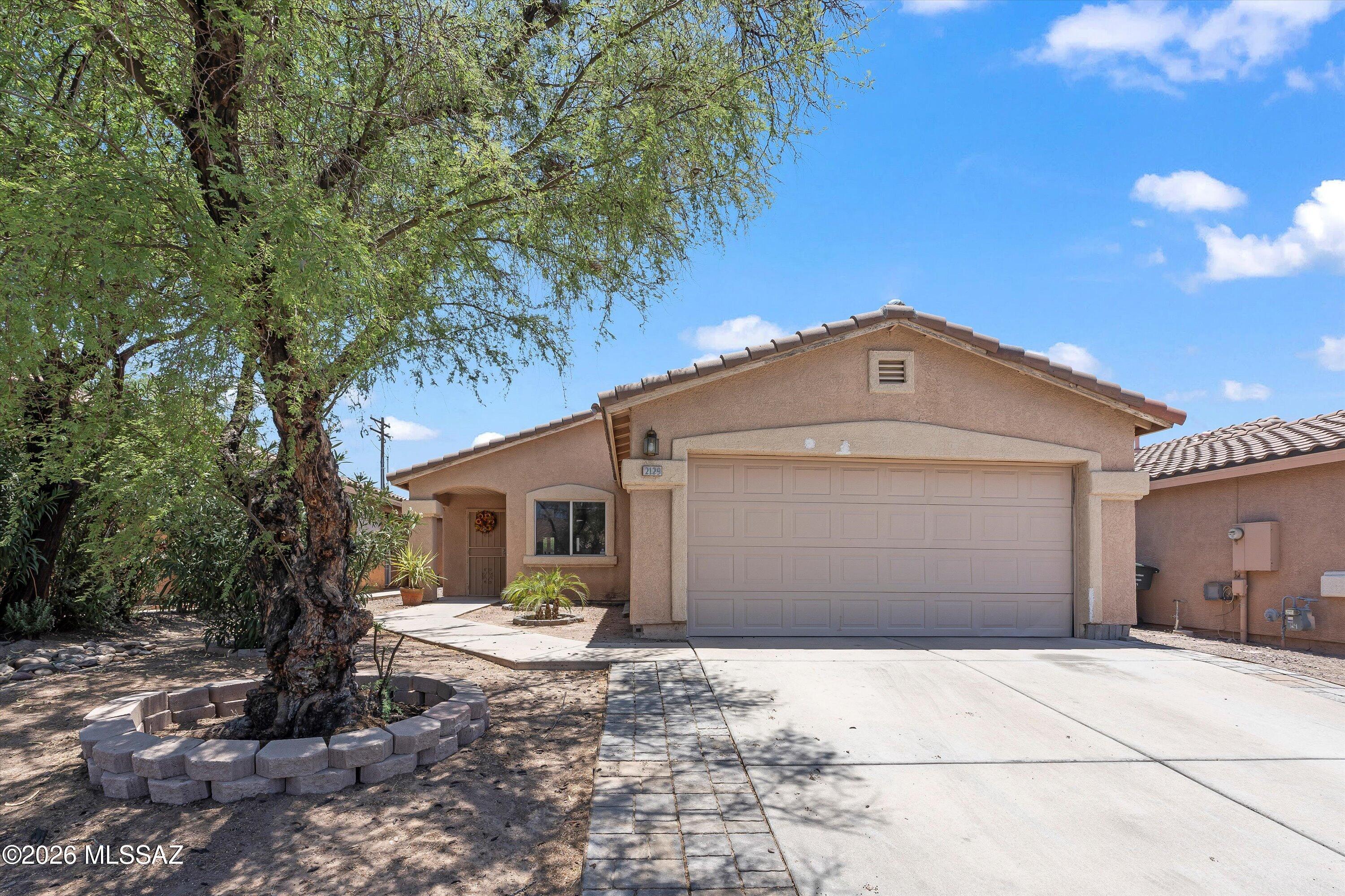 Time to step into homeownership! This house has everything you need to begin your journey, or continue your homeowner journey in a new place. Conveniently located near the corridor of Grant and Silverbell, you have all of your conveniences right in your own backyard. Safeway, Walgreens, Anytime Fitness and Teresa's Mosaic Cafe! The West side of Tucson is known for the marvelous sunsets and hiking, and you are just minutes away. 3 bedroom, 2 bath with high ceilings and a covered back patio. The backyard is clean and ready for your dreams to become a reality! Kitchen boasts slate refrigerator, stainless steel appliances and a generous doube-sink. Mini-splits in the bedrooms make the place ultra cool in the summers. Clean and ready for you! Buyer to verify all facts+figs incl those in MLS.