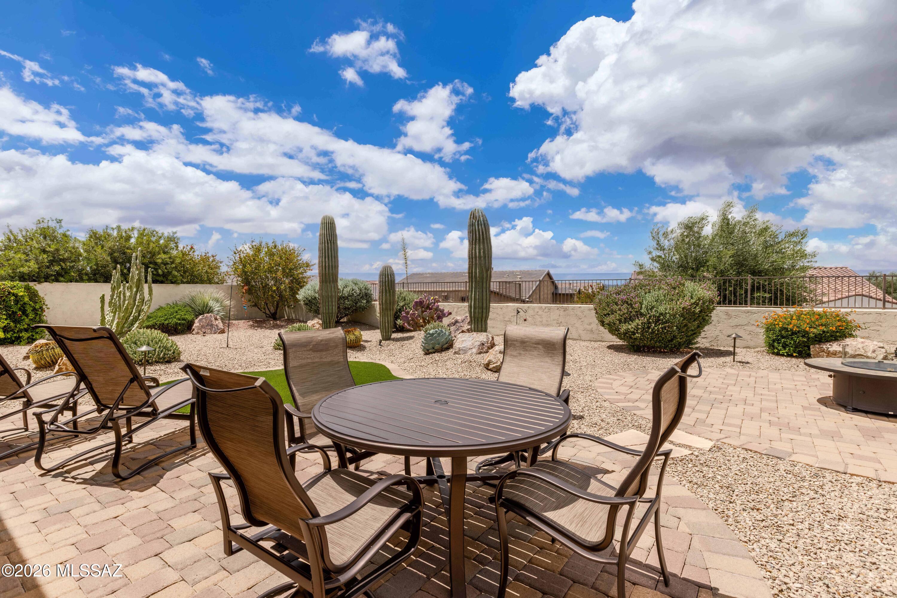 Wake up to panoramic mountain views and step into a lifestyle you've earned -- this immaculate Tesoro model with a private casita sits on an elevated homesite above the neighborhood, offering exceptional privacy and breathtaking views from both the front yard and back side yard.

Meticulously cared for by a single owner, this pristine, like-new home showcases an impressive list of upgrades throughout. Inside, quartz countertops, a gas cooktop, soft-close cabinetry, crown moulding, plantation shutters, and a custom built-in  2 primary closets reflect the quality built into every corner. The primary suite flows directly to the back patio, the guest bath features a tub, and a versatile den with carpet and doors is perfect for a home office or hobby room. The private casita is ideal for visiting family, while the fully fenced, low-maintenance backyard -- with turf, a gas fire pit, electric patio shades, drip irrigation, and a gas grill stub -- means more time enjoying life and less time on upkeep.

The extended garage is a standout: dedicated golf cart bay, epoxy floors, utility sink, storage cabinets, and a side entry door. Additional upgrades include a whole-house water softener, reverse-osmosis drinking water system, upgraded windows, iron security door, and in-ceiling fire sprinkler system -- everything considered, nothing overlooked.

In the heart of SaddleBrooke Ranch -- one of Arizona's premier 55+ communities, with championship golf, resort pools, pickleball, dining, and world-class amenities at your doorstep -- this is the home where your next great chapter begins.