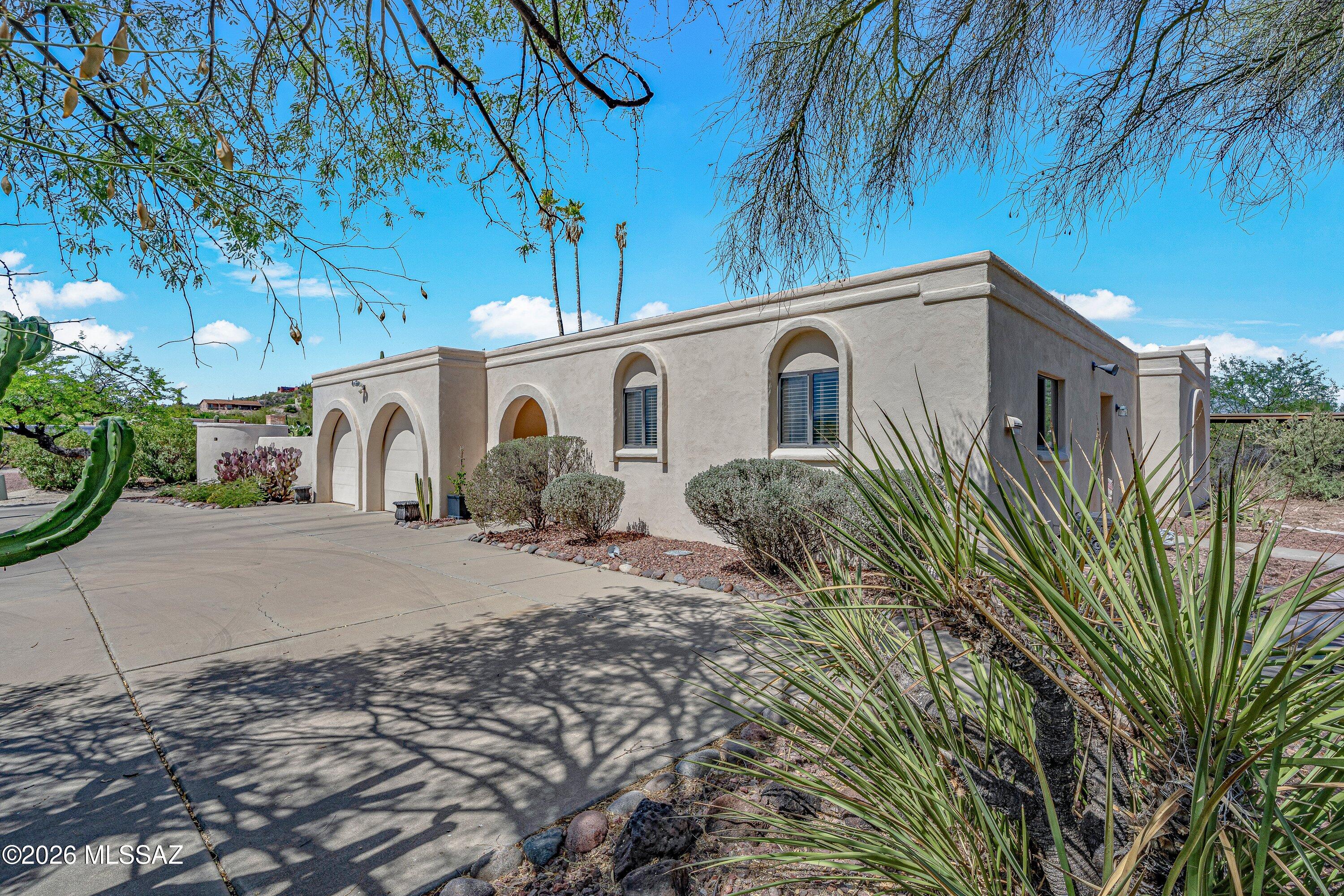 Enjoy stunning Catalina Mountain views from this meticulously maintained Territorial-style home in Hidden Valley, one of the Catalina Foothills' most sought-after neighborhoods. Offering 2,800 square feet of single-level living, this 3-bedroom, 3-bath residence is surrounded by the beauty of the Sonoran Desert and is just minutes from Sabino Canyon. The thoughtfully designed floor plan opens to inviting outdoor living spaces featuring a sparkling pool and spa, perfect for enjoying Tucson's year-round sunshine. Residents have access to Hidden Valley's private Wes Miller Park, while nearby shopping, dining, golf, biking, and hiking provide endless opportunities to enjoy the Foothills lifestyle. Located within the highly acclaimed Catalina Foothills School District, this move-in-ready home offers the perfect blend of comfort, privacy, and convenience.