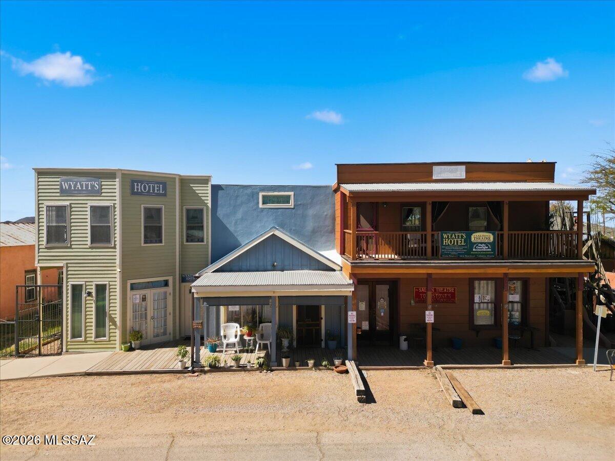 Steps away from Tombstones historic district & main street, Allen Street & the OK Corral. Currently operating as a hotel and theatre with wild west reenactments. Hotel: Upstairs 1 private apartment with bedroom, bathroom, living room, dining room,kitchen & private balcony. 3 guest suites w/ private bathroom, one with balcony views of the town. Plus a laundry room, storeroom & gathering space. Downstairs: 1 studio apartment with full bath and 1 apartment with kitchen, bedroom, living room, bathroom & storage. The theatre space is ideal for hosting events & gatherings with a separate entrance. Furnishings & decor included in the sale.