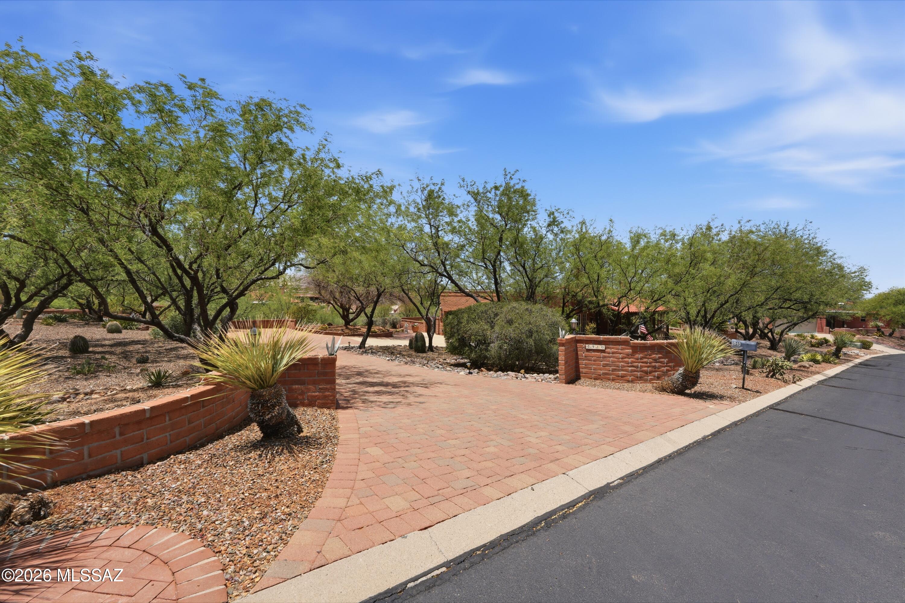 CUSTOM HOME ON 1.1 ACRES IN CANOA CANYON ESTATES
Discover distinctive Southwest living in this custom home nestled on 1.1 acres in the desirable Canoa Canyon Estates community. Just minutes from the shopping, dining and conveniences of Green Valley, this spacious 2-bedroom, 2-bath residence offers a private office, expansive Arizona room and an inviting blend of comfort, character and privacy.
A grand foyer welcomes you into an impressive living room featuring a cozy fireplace and wet bar, creating an ideal setting for entertaining or relaxing at home. The open kitchen flows into a generous informal dining area, while a separate formal dining room provides an elegant space for special gatherings. The oversized primary suite offers a peaceful retreat with direct access to a private back patio, where you can relax and enjoy beautiful mountain views. With its spacious floor plan, custom features and desirable 1.1-acre setting, this exceptional home offers the privacy and lifestyle that make Canoa Canyon Estates so special. Canoa Canyon Estates planned community is a quiet neighborhood subdivision comprised of 140 homes.   Established in 1985, this neighborhood is nestled between the Canoa Hills Walking Trails on the north and south and bordered by Camino del Sol on the East