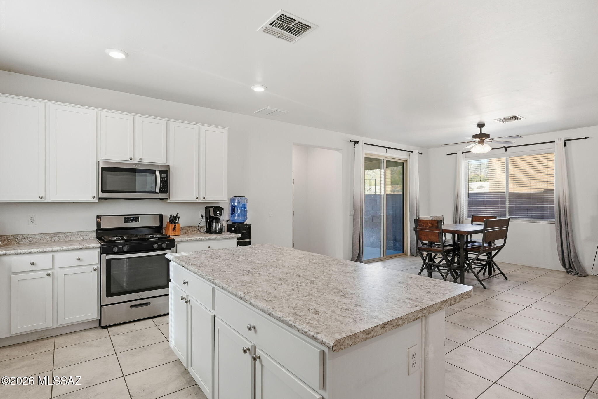 Charming single-story home is now best deal on the market! This gem is nestled in a quiet cul-de-sac with beautiful mountain views, offering 3 bedroom split floor plan, 2 bathrooms, and a 2-car garage. The interior has tile floors & abundant natural light, The kitchen has lots of white cabinets, ample counter space, built-in appliances, and an island, perfect for midnight snacks and meal prep. The primary bedroom is large with an ensuite with dual sinks. Separate laundry room with newer washer/dryer included!  Dual zone A/C system to keep the areas you are using cool. Don't miss out on this amazing offer! Get ready for weekend grills and peaceful evenings in the backyard, including a covered patio ideal for morning coffee and a nice seating space where you can enjoy outdoor dining with the stunning mountains as the backdrop. Hurry up, this one will sell fast!