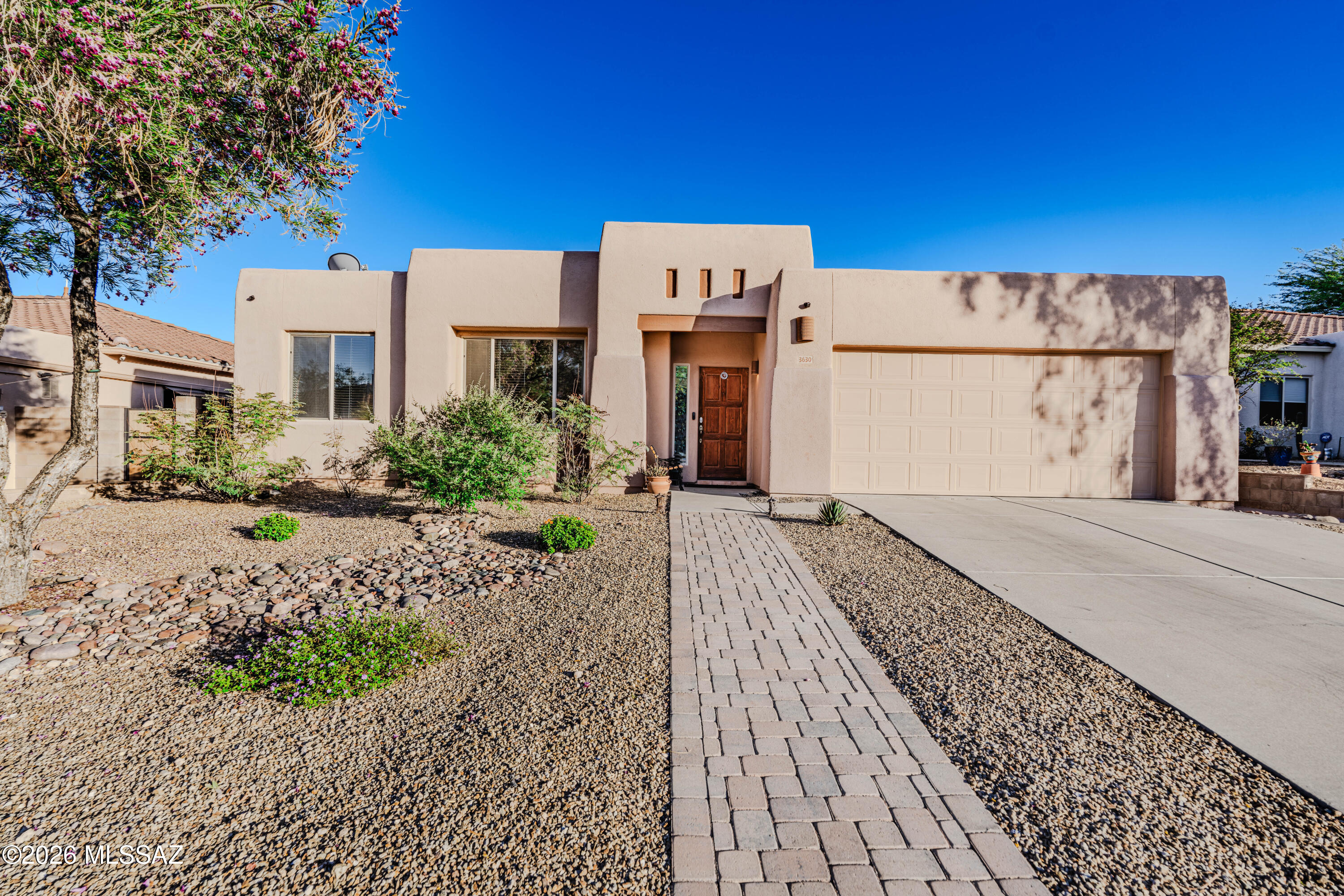Enjoy peaceful desert living in this beautifully maintained 3-bedroom, 2-bath home located in the highly desirable gated community of Rancho Agua Dulce on Tucson's westside. With unobstructed desert views behind the home, this property offers a rare blend of privacy, natural beauty, and everyday convenience.  Inside, you'll find a bright, open layout with a desirable split floorplan and no carpet throughout, creating a clean, modern, and low-maintenance living space. The spacious kitchen offers abundant countertop space, stainless steel appliances, and an easy flow into the main living and dining areas--ideal for both daily living and entertaining. Step outside to a thoughtfully designed low-maintenance backyard retreat, featuring extended paver patio space, a gazebo for shaded relaxation, and a newly planted lime tree. Whether you're enjoying morning coffee or sunset views, the backdrop of untouched desert creates a calm, open feel that is hard to find. Additional upgrades include a reverse osmosis system and water softener for added comfort and convenience.
Located just minutes from I-10, shopping, dining, and schools, this home offers both accessibility and seclusion. The gated community provides a quiet, well-kept environment with scenic walking trails, a sparkling pool, and a neighborhood playground.
Perfect as a primary residence or a strong rental investment, this move-in-ready Westside gem combines location, lifestyle, and low-maintenance living in one complete package. Be sure to read the Seller's "Why I Love This Home" essay in the attachments for a personal perspective on what makes this home truly special.