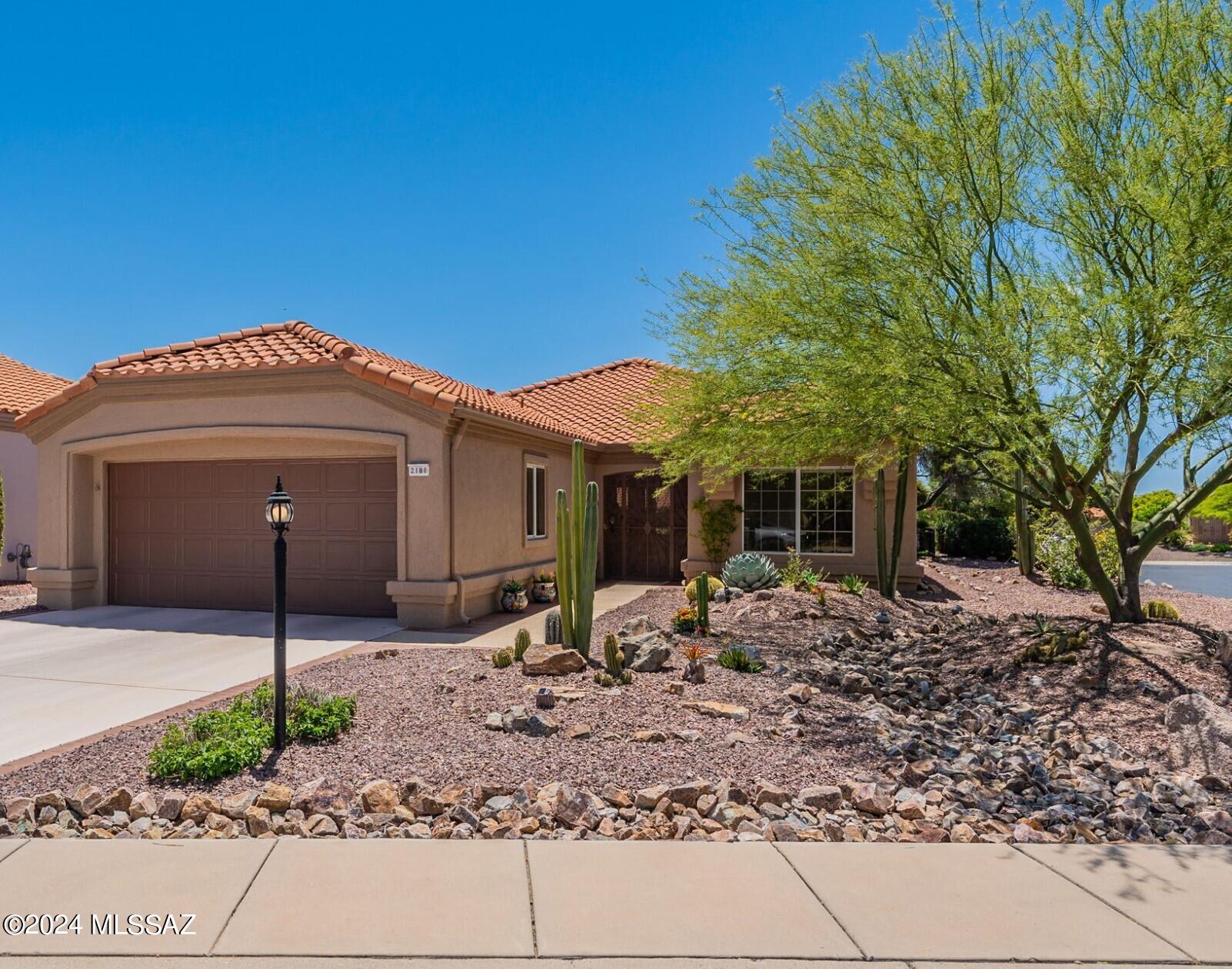 Enjoy Catalina Mountain views from this move in ready Mariposa model in sought after Sun City Oro Valley. The home sits on an elevated corner lot with privacy. This home features a bright open floor plan with updated ceramic tile throughout. Kitchen features updated appliances, quartz counters and breakfast bar. 
Private backyard with extended patio and retractable awnings, invites you to relax and entertain while enjoying beautiful landscape. Guest bedroom has built in wall bed and desk. Extra deep garage with utility sink and cabinets. 

Updates include roof underlayment 2018, new HVAC 2023, new picture window in living room, dining area and sliding door in dining area 2018.