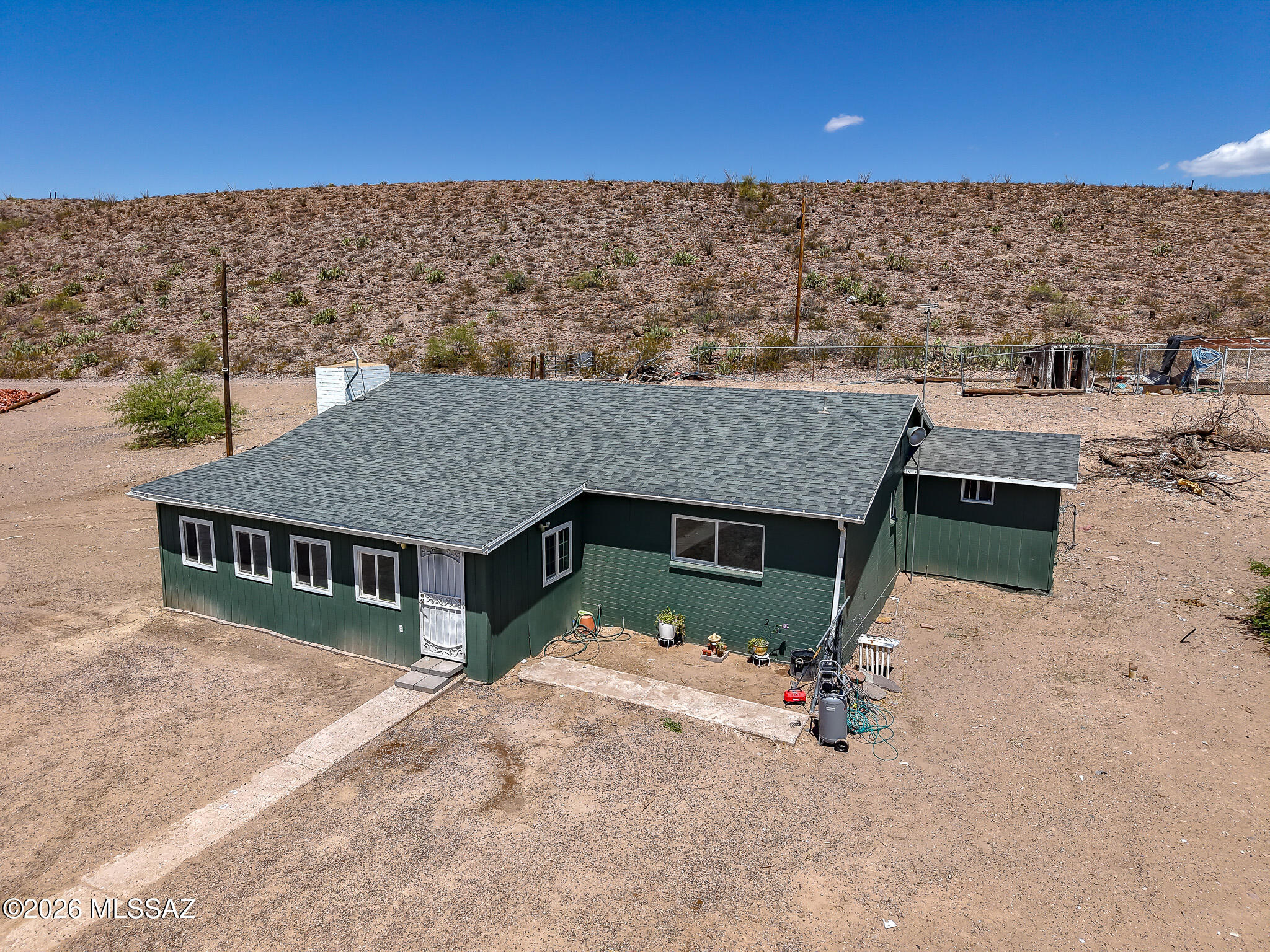Affordable country living near the Gila River and Gila Box Riparian Area! Situated on 5 acres, this 2 bedroom, 1 bathroom home offers privacy, open space, and beautiful desert surroundings. A standout feature is the 2,800 SF metal shop, formerly used as a bunkhouse and still retaining many of its original living-quarter features. Whether you're looking for a rural residence, workshop space, storage, or a property with future potential, this one offers a rare opportunity at an attractive price. Enjoy the peace and freedom of country living with room for projects, recreation, and more. New Roof and Exterior Paint 2026, and New Water Heater and Septic in 2023! SELLER IS WORKING ON CLEANING UP PROPERTY OF DEBRIS.