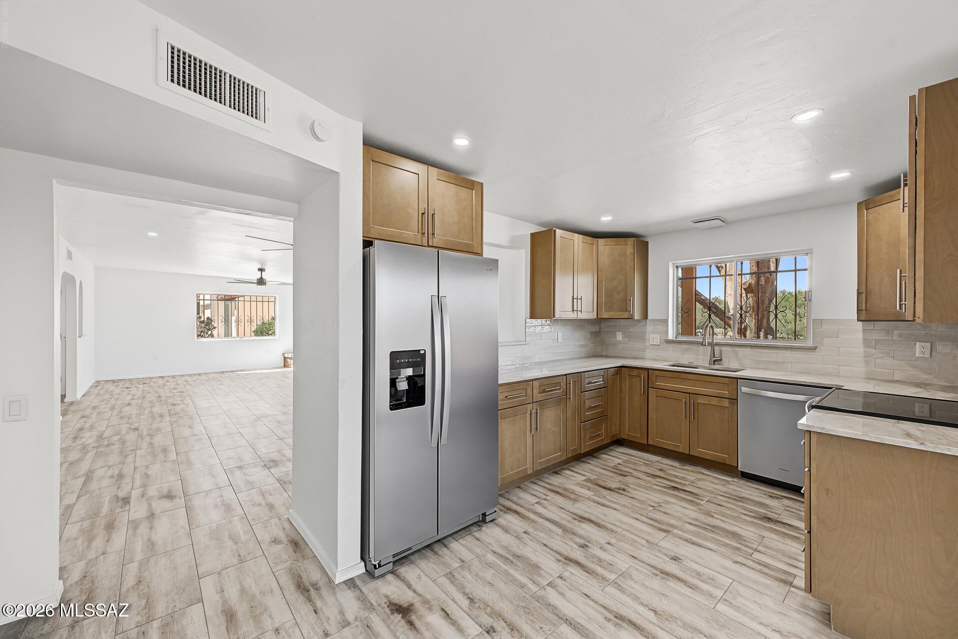 Very well thought out remodel has been completed on this lovely 55+ community townhome situated for the utmost privacy with expansive views. No neighbors will ever be directly behind you. Large open living space that flows outside to the TWO tiled patios, perfect for entertaining and enjoying morning coffee and evening cocktails. All new cabinets, Taj Mahal granite counters and new stainless steel appliances in the kitchen with an abundance of natural light. Bathrooms have floor to ceiling tile in the showers. Smart Strand carpet by Mohawk in both bedrooms. A bonus room off the master with garage access that can be a studio, workshop or home office. Seller has never lived in the home. No Insurance Claims History Report. Buyer to verify sq ft if material matter. Floor plan in documents tab.