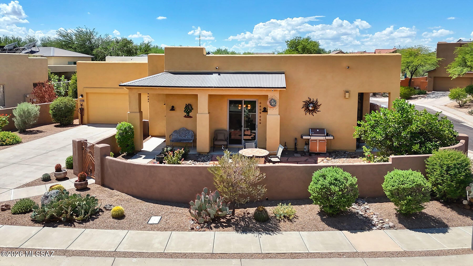 Exceptional Civano North Ridge home on premium corner lot w/captivating Catalina Mountain views. Built by Pepper-Viner, this beautifully appointed 3-BR/2-ba home offers 1,528 sq ft of light-filled living, a welcoming great room, generous kitchen & multiple patios for enjoying the views. Features include 20-inch tile, gas beehive fireplace, granite kitchen w/double ovens, stainless appliances & rollout cabinetry. The owner's suite & great room showcase mountain views. Brand-new A/C installed 9/2026.   Enjoy Civano's unique Sonoran Desert setting w/scenic parks, walking/biking paths, community garden, 2 pools, tennis/pickleball courts, playground, sports park w/soccer & basketball, neighborhood center and more. Near Saguaro National Park, shopping, dining, and other services.