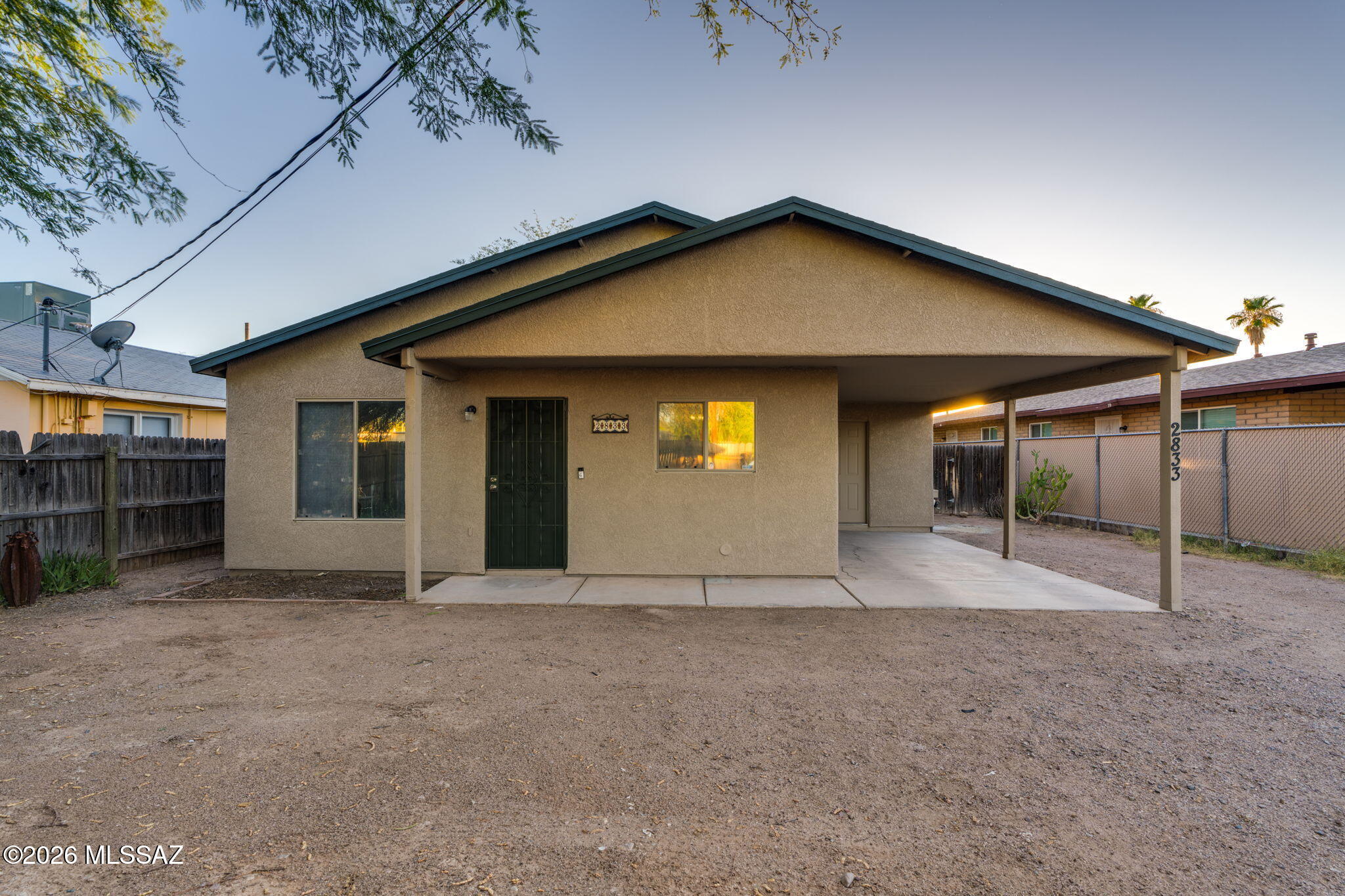 Completely move-in ready with fresh interior/exterior paint, a newer HVAC, and seamless tile flooring throughout. The bright, open layout features 9ft+ ceilings and gorgeous natural light. Built in 2002, it offers a rare, modern alternative to the surrounding 1950s/60s built homes. Unlike the older homes in the area, the bedrooms here are generously sized, featuring an expansive primary suite with plenty of room to spread out. The massive backyard, which is shaded by mature trees, has endless potential for outdoor living. Perfectly situated close to the Tucson Botanical Gardens and vibrant local businesses. You are in a prime position to experience central living. The University of Arizona and I-10 freeway access are both just a 10 minute drive from your front door.