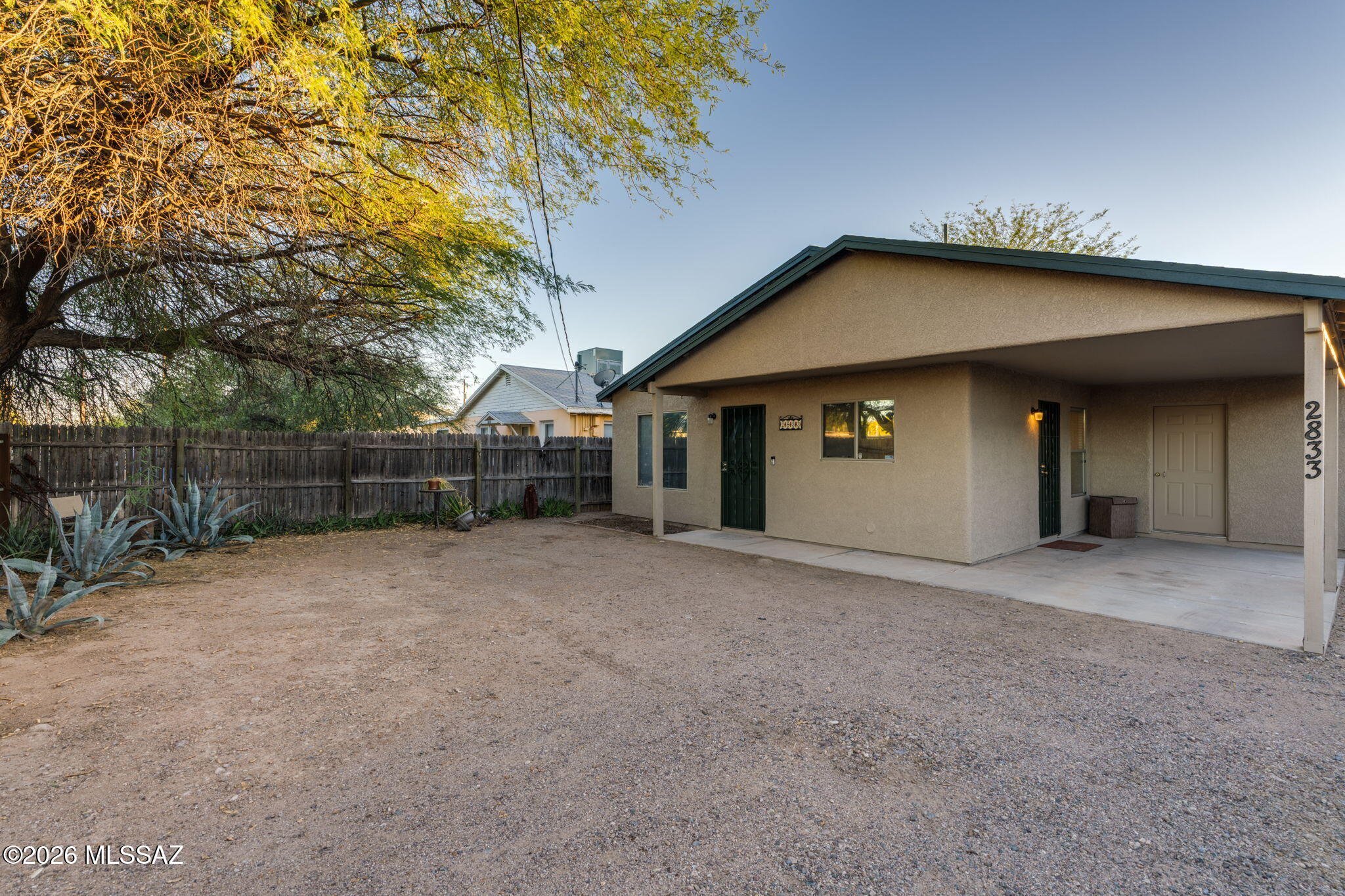 Completely move-in ready with fresh interior/exterior paint, a newer HVAC, and seamless tile flooring throughout. The bright, open layout features 9ft+ ceilings and gorgeous natural light. Built in 2002, it offers a rare, modern alternative to the surrounding 1950s/60s built homes. Unlike the older homes in the area, the bedrooms here are generously sized, featuring an expansive primary suite with plenty of room to spread out. The massive backyard, which is shaded by mature trees, has endless potential for outdoor living. Perfectly situated close to the Tucson Botanical Gardens and vibrant local businesses. You are in a prime position to experience central living. The University of Arizona and I-10 freeway access are both just a 10 minute drive from your front door.