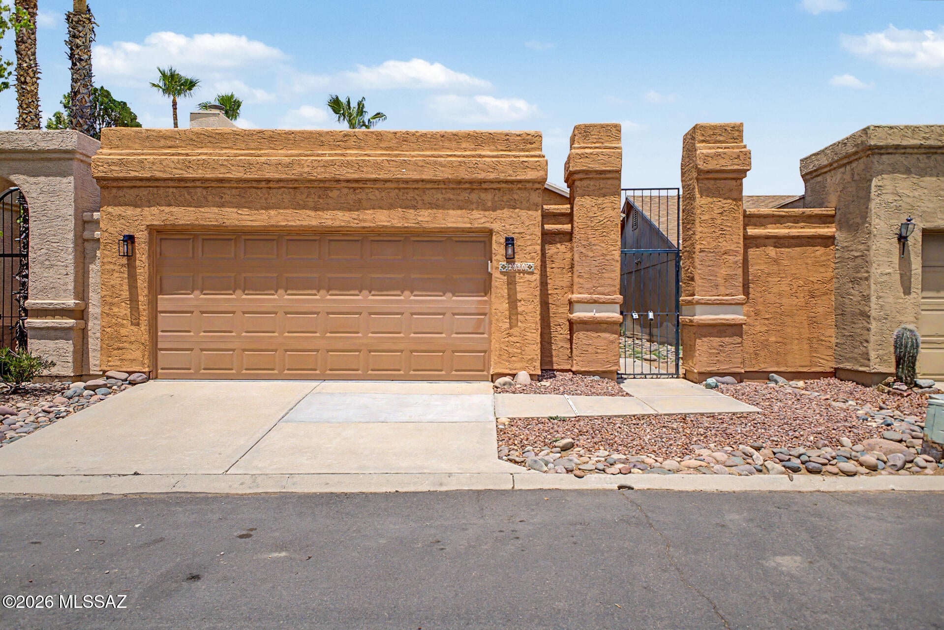 Move-in ready 2BR/2BA in coveted NW Tucson! Features luxury plank flooring, new bedroom carpet, fresh interior paint, and modern lighting. Kitchen boasts quartz countertops, light brown cabinetry, and stainless steel appliances. Refreshed bathrooms include updated plumbing fixtures and new vanities. Enjoy a covered patio and private backyard. Located in the award-winning Marana School District! HOA includes community pool, playground, and trash. Schedule a tour today!
