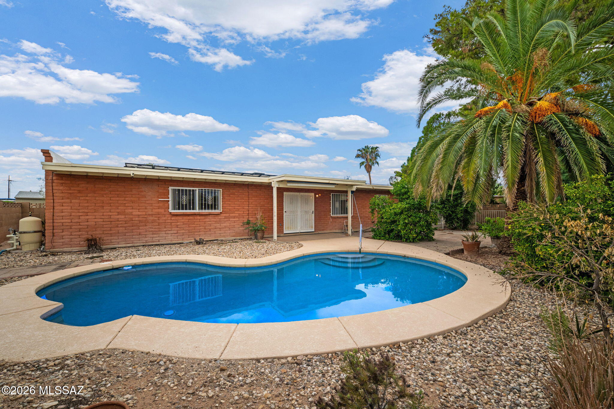Situated in a desirable Tucson neighborhood near Udall Park, this 4-bedroom, 3- full bathroom home offers 2,055 sq. ft. of living space and exceptional potential. Set on a .23-acre corner lot, the property features a private pool and a spacious setting ready to be reimagined. While updates and improvements are needed, the generous floor plan, desirable location, and existing outdoor amenities present an excellent opportunity to customize and create a home tailored to your vision. Whether you are looking to renovate, invest, or make it your own, this property offers a wonderful opportunity to unlock its full potential in an established and sought-after area of Tucson.