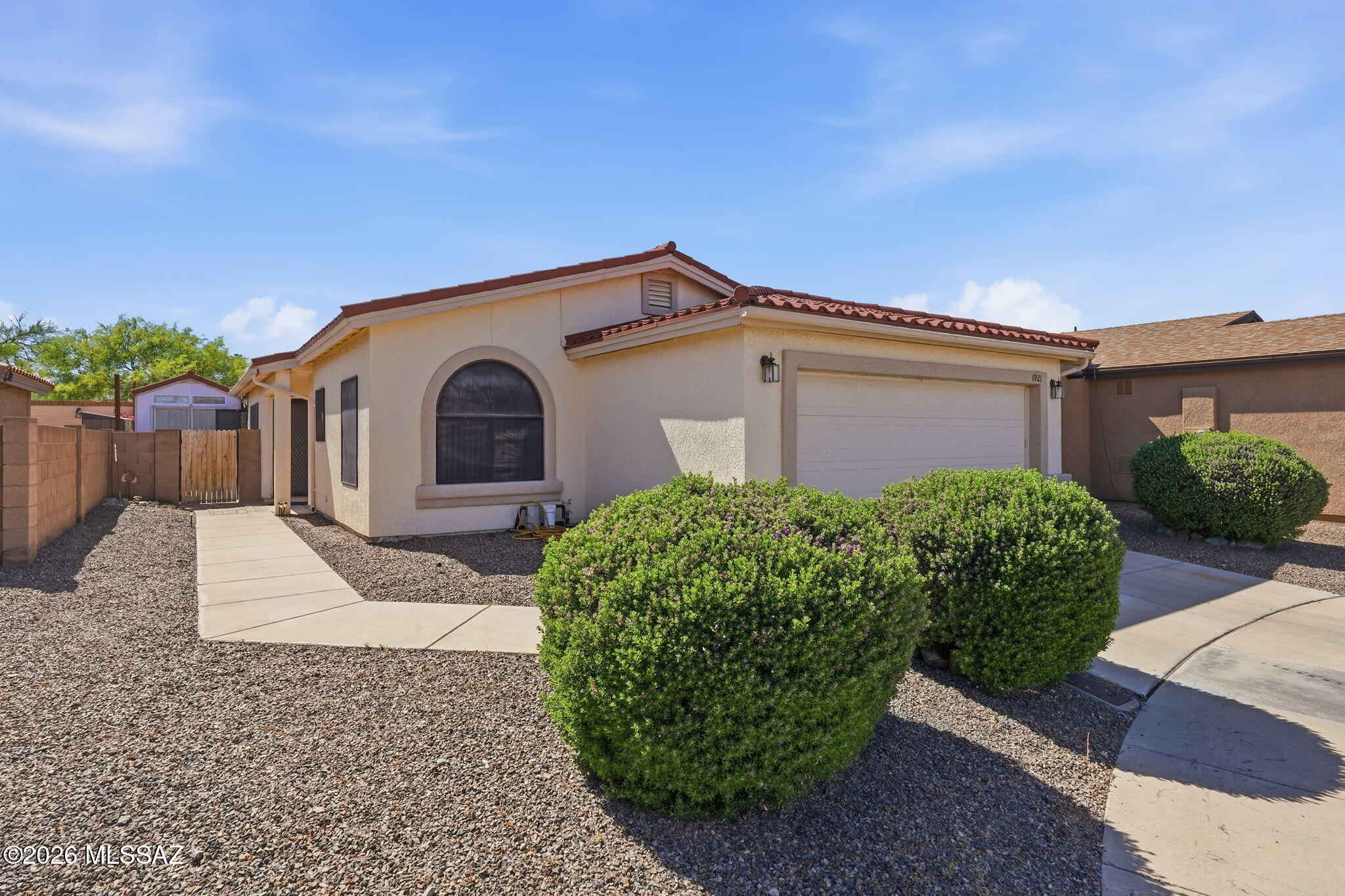 A rare find in Green Valley, AZ . . . a sub-division that IS NOT AGE RESTRICTED . . .  and NO GVR . . . but has its own recreation area . . . swimming and fitness center!  GVR is available to those who wish to join.  Located on a quiet cul de sac is this two bedroom (guest room has a murphy bed), two full baths, two car attached garage (with an extra storage room), 1006 sq ft home. Enjoy the enclosed back covered patio with your own hot tub.  Additional storage shed on the side of the house. Convenient to schools, shopping and Interstate 19.  Welcome home.