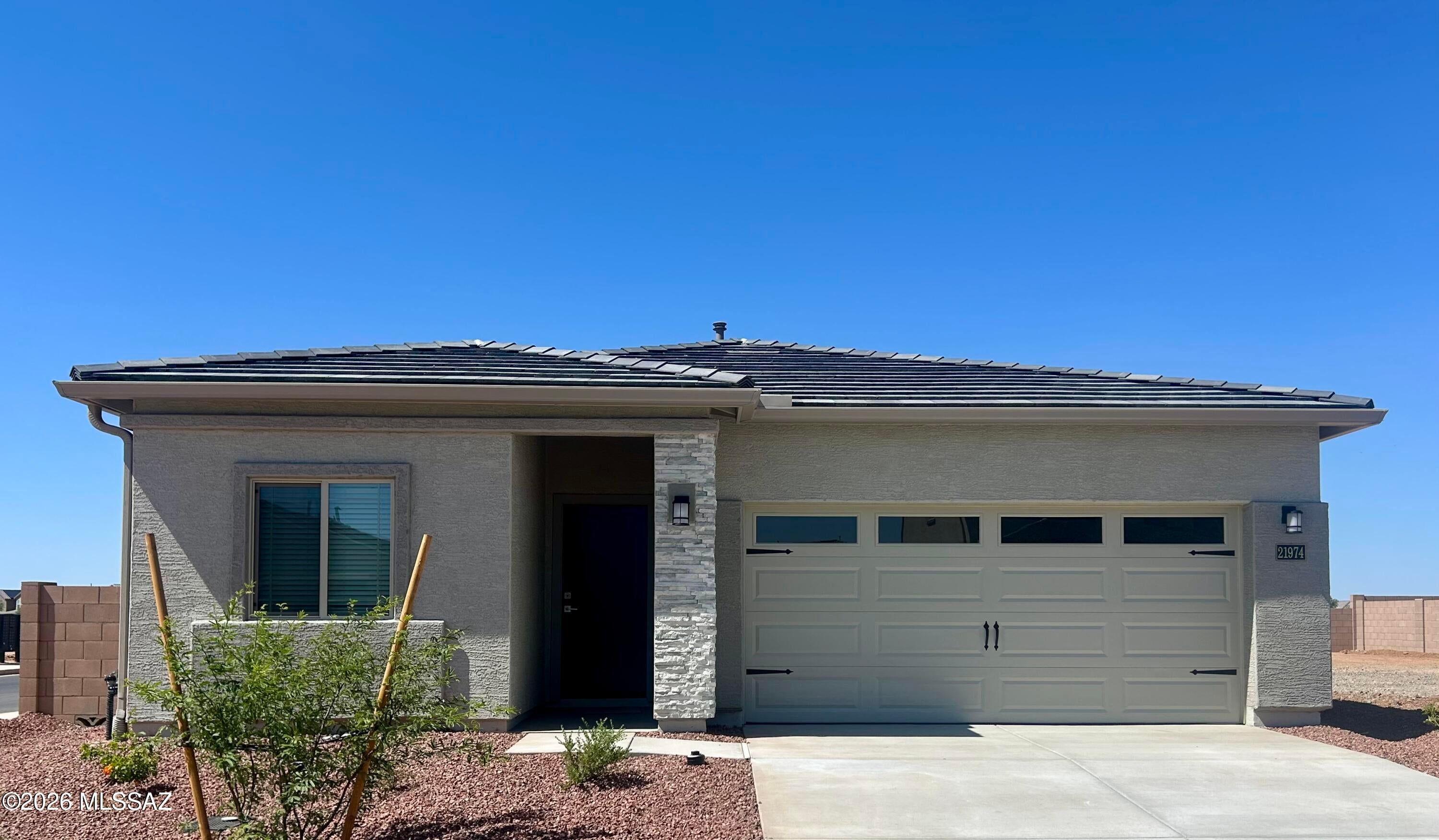 The Amado plan by LGI Homes is a must-see! This home is meticulously crafted with a focus on both style and functionality. This three-bedroom, two-bathroom home showcases a thoughtfully designed layout that exudes comfort. The family room seamlessly connects to a beautifully upgraded kitchen, creating an inviting space for daily living and entertaining. Nestled in a tranquil corner, the master suite offers a haven of serenity and seclusion. Two more bedrooms provide ample space for your family or guests to relax in their own comfort. Better yet, this home is located in the amenity-packed community of Red Rock Village. You will love calling this area home!
