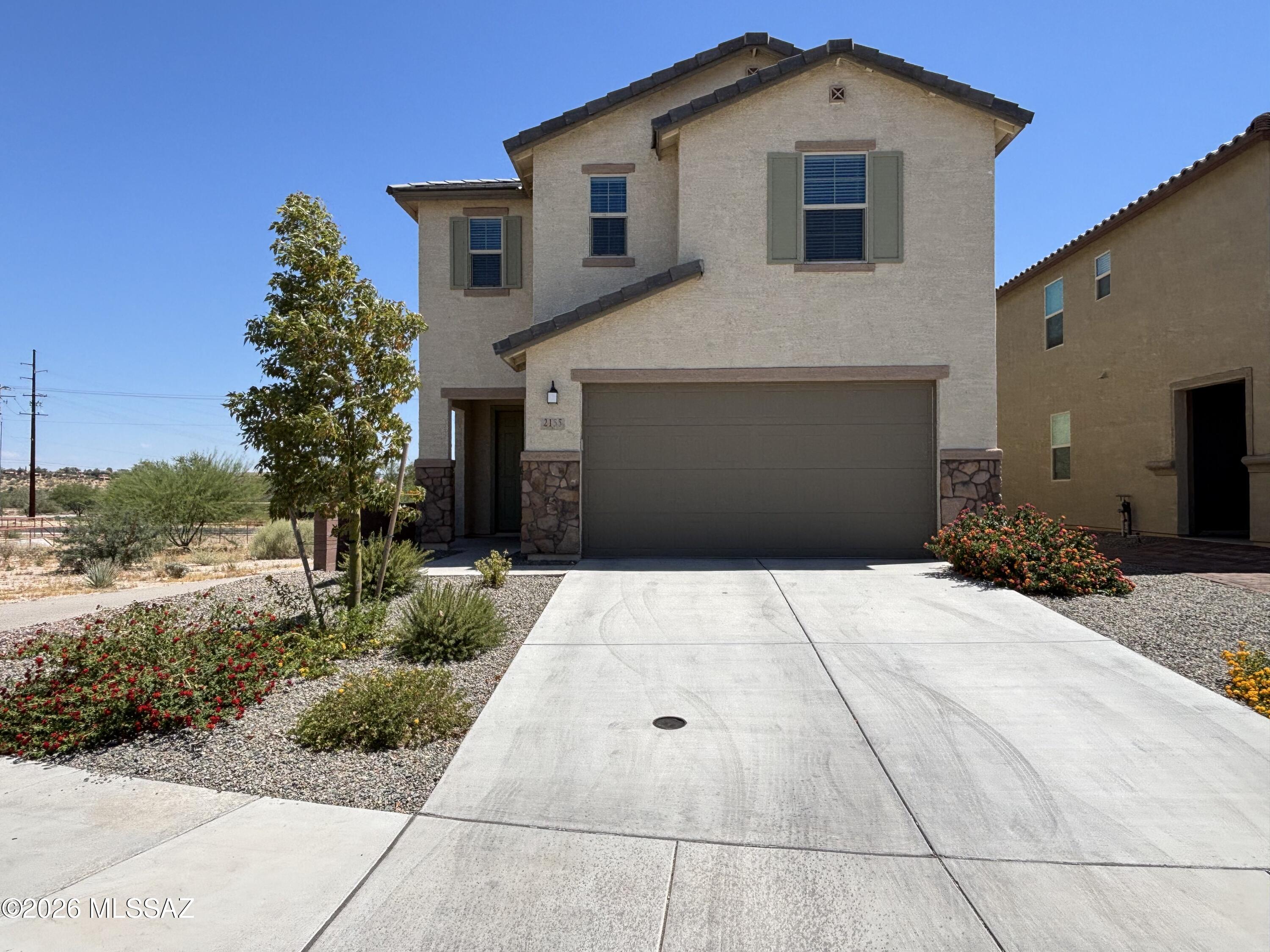 Beautiful 4BR Home with Loft & Den in Prime Northwest Tucson Location! This spacious two-story home offers an open-concept layout with 9-ft ceilings and abundant natural light. The inviting great room flows seamlessly to a covered patio, perfect for relaxing or entertaining. The modern kitchen features granite countertops, ample cabinetry, a pantry, and stainless steel appliances. A downstairs den provides the ideal space for a home office or study. Upstairs, enjoy a versatile loft perfect for work, entertainment, or a play area. The primary suite includes a walk-in closet and a private bath with dual sinks and a walk-in shower. Conveniently located near shopping, dining, and less than 8 miles from Catalina State Park, offering easy access to hiking, biking, and outdoor recreation.