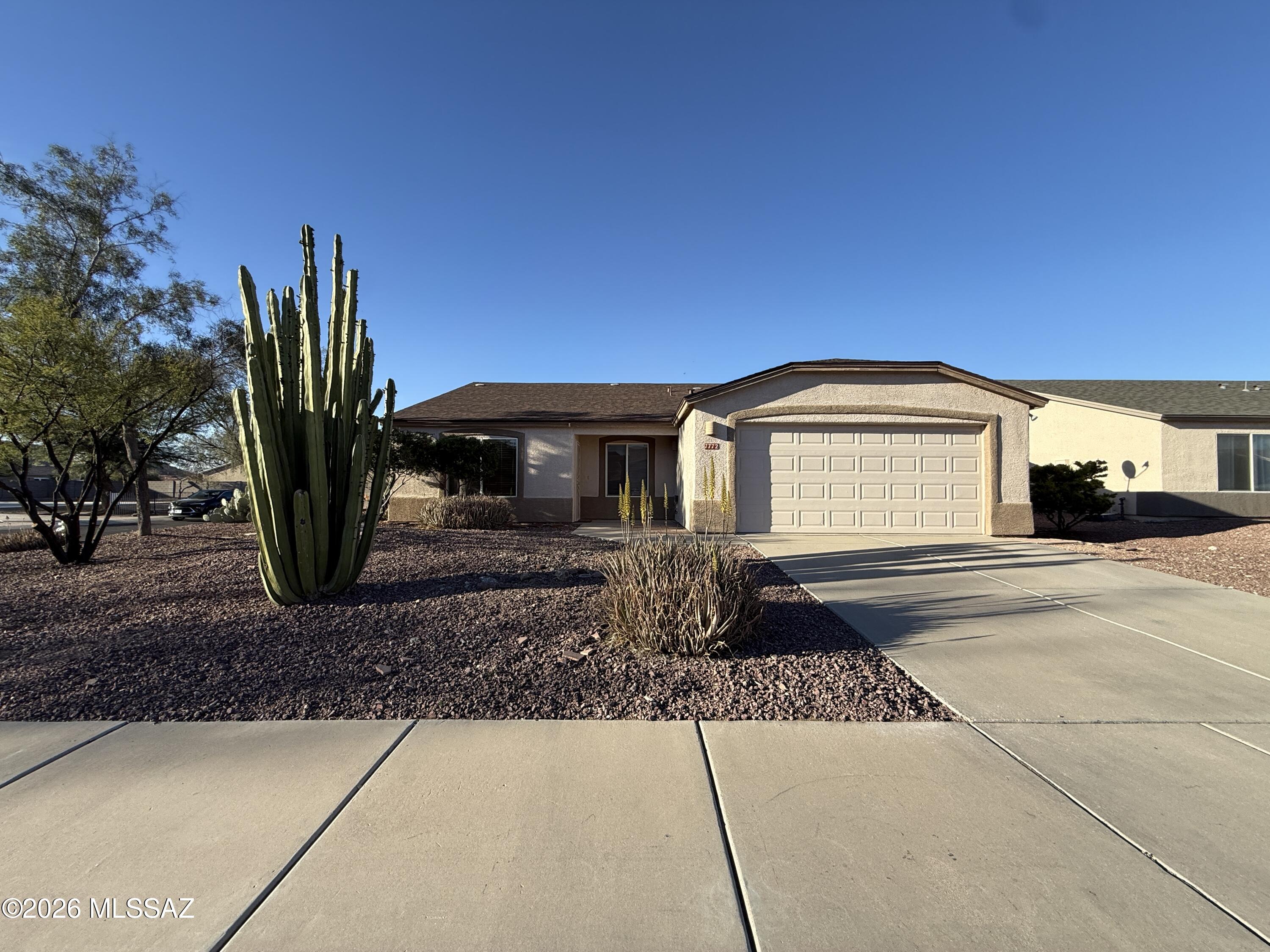 Welcome to this 4-bedroom, 2-bath home with 1,679 sq ft in the Silver Moon community of Tucson. Situated on a corner lot, this home features a spacious living/dining room combo and a functional kitchen with tile floors, newer-style cabinets, and appliances. The primary bedroom includes an attached bathroom, and an indoor laundry room adds convenience. Step outside to a backyard with a covered patio and private in-ground pool--perfect for relaxing or entertaining. Complete with an attached two-car garage and driveway, this home offers comfort and practicality in a great location.