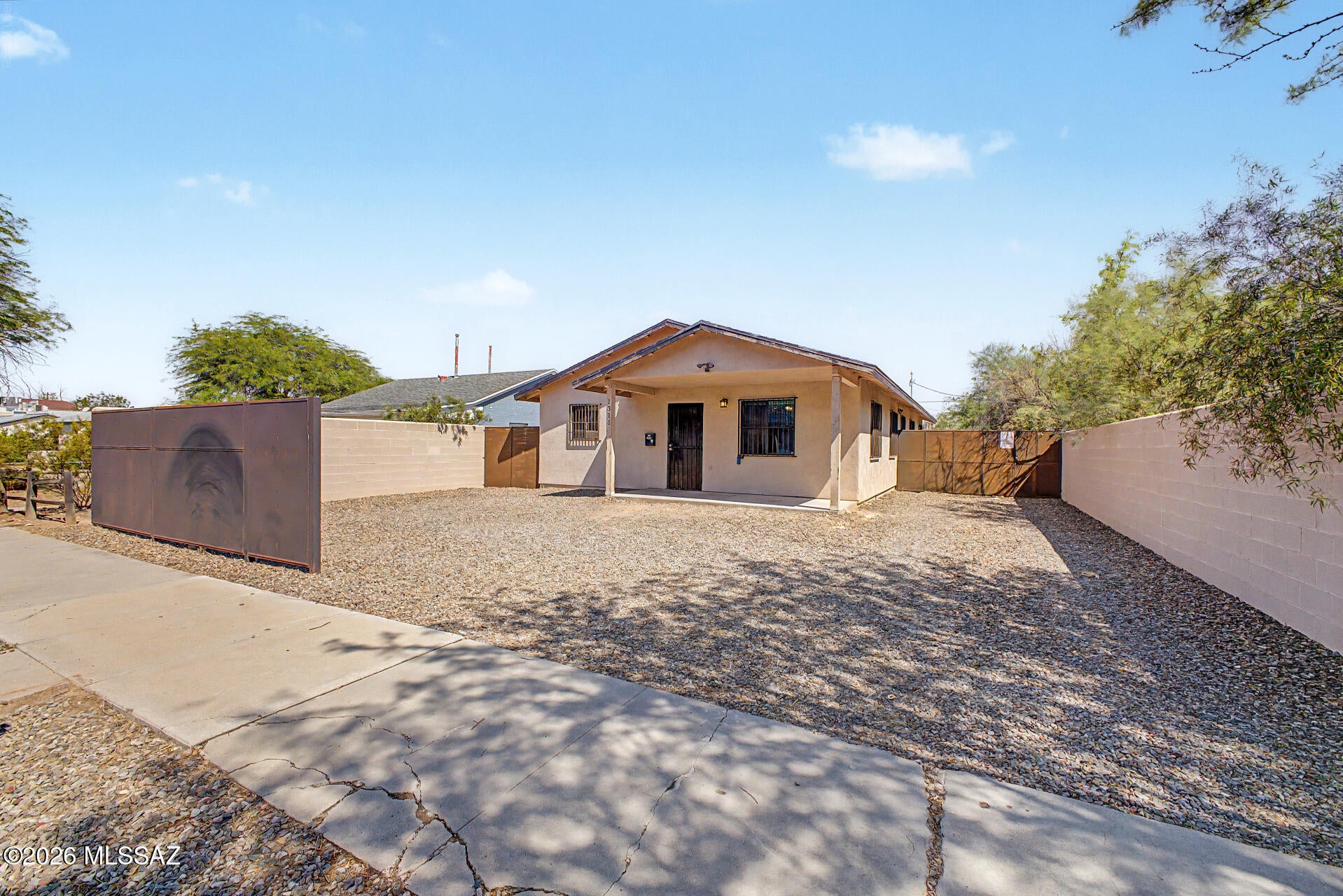 Prime Investment Opportunity Near the UofA! This newer-construction home is ideally located just three blocks south of the University of Arizona and Student Recreation Center, with convenient access to downtown, Banner Hospital, and major employment centers. The home features tile flooring throughout, quality solid-wood cabinetry, and a functional floor plan designed for comfortable living. Security bars on doors and windows provide added peace of mind. An excellent income-producing property with strong rental appeal for students, professors, university personnel, and hospital staff. A great opportunity to own a well-located investment property in the heart of the UofA area!