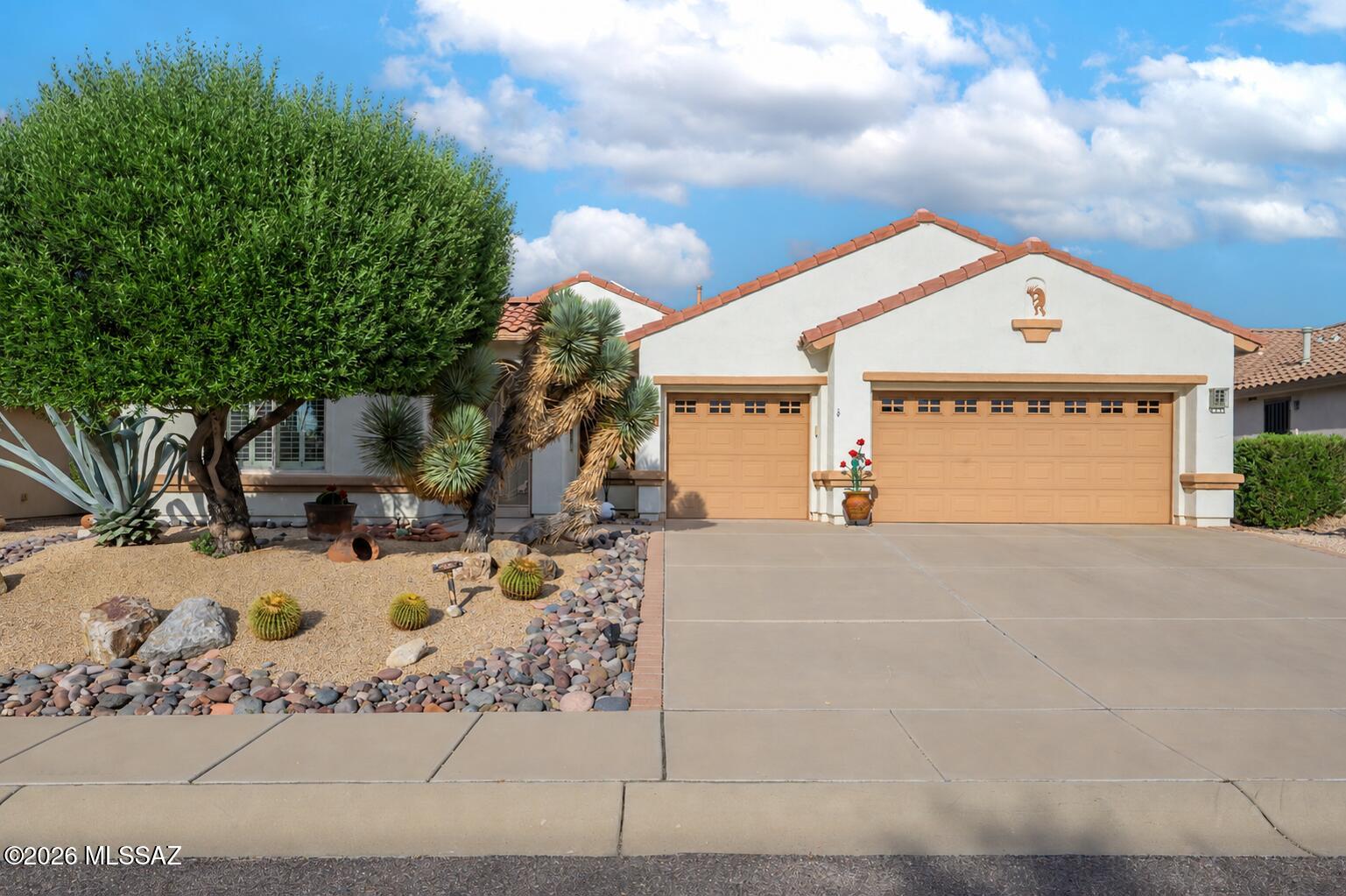 Experience refined desert living in this meticulously maintained, one-owner Talavera model, beautifully positioned along State Trust Land in the sought-after Quail Creek community. Offering a combined 2,411 sq. ft. of living space, this distinctive residence features 3 bedrooms, 3.5 baths, a versatile den/office, and a private guest casita that creates an ideal balance of comfort, flexibility, and privacy. Designed for effortless living and entertaining, the split floor plan provides excellent separation between the primary suite and guest accommodations. At the heart of the home, the large kitchen with an abundance of storage and granite countertops flows seamlessly into the open living area, where abundant natural light and views of the resort-style backyard create an inviting gathering space. The solid-surface flooring throughout the main living areas adds to the home's clean, polished feel.Step outside to an exceptional setting designed around the Southern Arizona lifestyle. A custom pool and spa anchor the backyard, with a waterfall flowing into the pool and a gas fire pit for evenings outdoors. An expansive covered patio with sunshade, built-in gas grill, and mature desert landscaping complete the space. Whether hosting neighborhood gatherings, welcoming winter visitors, or enjoying a quiet evening beneath the Arizona sky, this outdoor space was made to be enjoyed.
Bordering State Trust Land, the property offers added privacy and an open natural backdrop showcasing the beauty of the Sonoran Desert and Santa Rita Mountains. An extended 3-car garage with built-in storage provides generous room for vehicles, a golf cart, hobbies, and more. Adding further value is a prepaid solar lease through 2031, providing the benefits of solar with no additional lease payments during the remaining term.
Beyond the residence, enjoy the coveted Quail Creek lifestyle with championship golf, resort-style pools, fitness facilities, pickleball, dining, clubs, and an active social calendar. With a private casita, resort-style outdoor living, and a spectacular setting framed by the Sonoran Desert and Santa Rita Mountains, this exceptional residence offers a rare opportunity to experience the very best of the Quail Creek lifestyle.