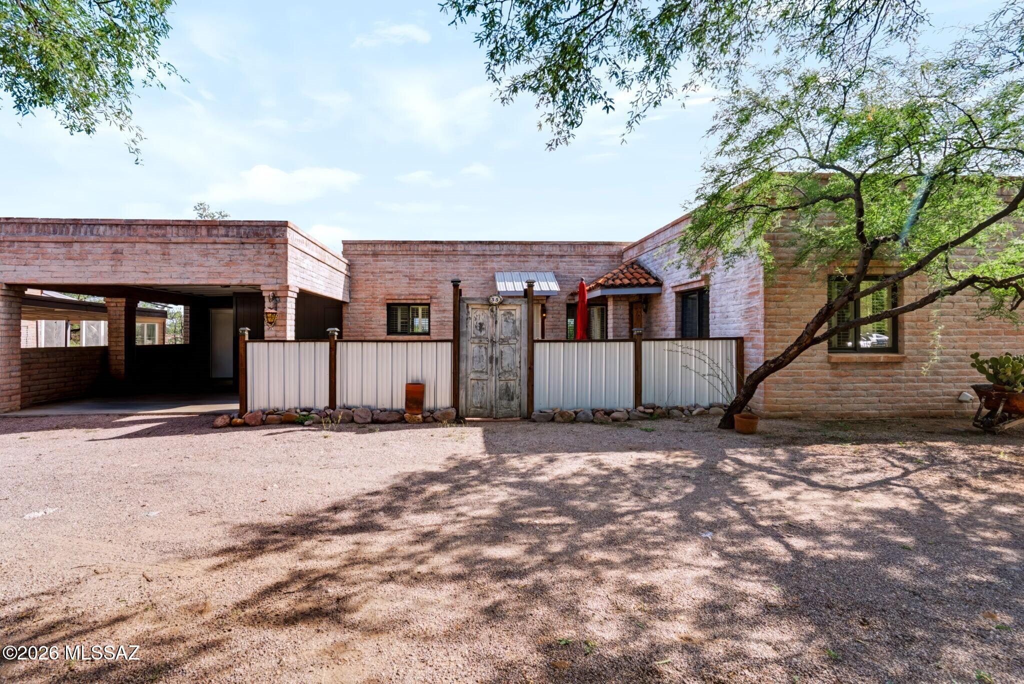 Home, creative space and income potential come together in the heart of historic Tubac Village. This distinctive property offers a one-bedroom, one-bath residence with separate-entry casita, giving you the flexibility to live in the residence and use the casita as an artist's studio or rental unit. A light-filled den features spectacular mountain vistas, exposed beam ceilings and cozy fireplace, plus open-concept gathering space. Separate casita is ideal for multigenerational households, guest quarters, hobby room or studio. Set near Anza trailhead, St. Ann's Church and the Tubac Presidio, you'll be right in the middle of the village's history, art and charm. Zoned for either residential or commercial use, and subject to applicable approvals, the possibilities here are virtually limitless.