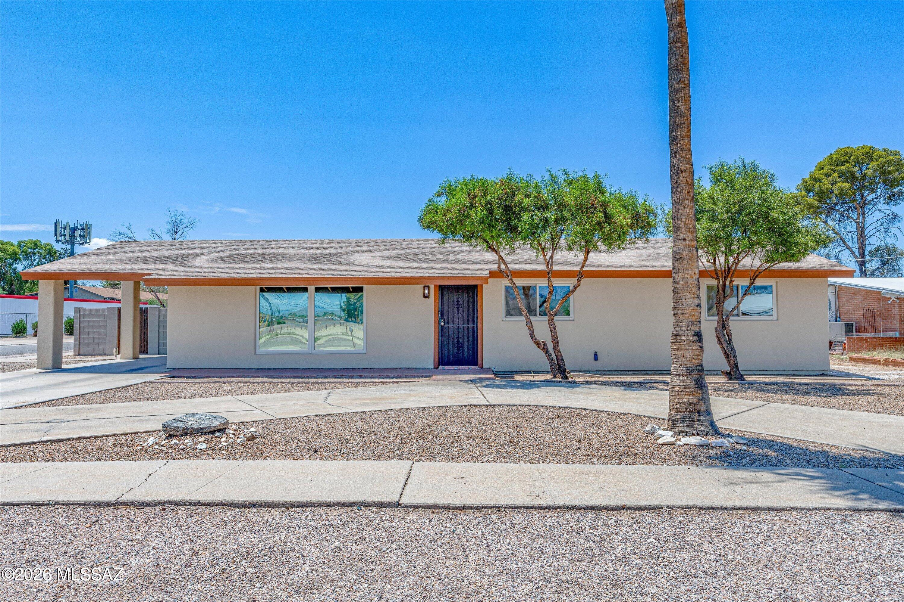 Beautifully updated & move-in ready 3-bedroom, 2-bath home offering 1,448 sq. ft. of comfortable living space on a spacious corner lot. Inside, you'll find tile flooring throughout & a bright, updated eat-in kitchen featuring a breakfast bar with seating, pendant lighting, tile backsplash, & a sliding glass door leading to the extended covered patio. The primary suite includes a private bath, while the guest bathroom has also been tastefully updated. The low-maintenance backyard offers a double gate & large concrete slab, making it easy to park an RV, boat, trailer, or other toys. A detached two-room studio/workshop with its own mini-split heating and cooling system provides incredible flexibility for a home office, gym, art studio, hobby space, or guest retreat. Conveniently located.