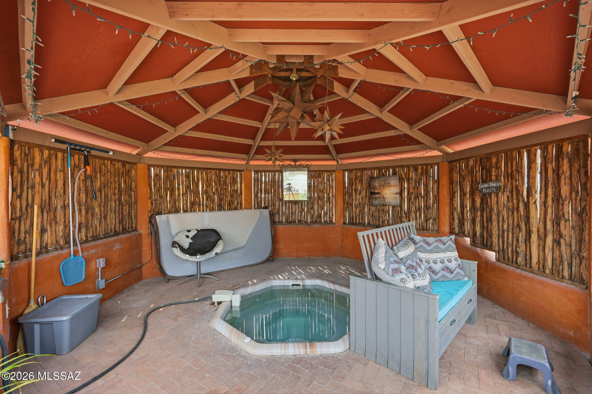 Welcome to your serene desert retreat in Bel-Air Ranch Estates! This charming property sits on a 1.2-acre lot and offers the perfect blend of comfort and southwestern character. Inside you'll find three bedrooms and two and a half bathrooms, featuring Saltillo tile and warm natural finishes. The kitchen boasts concrete countertops, offering durability and rustic charm. A separate office/workshop with it's own mini-split system provides ideal space for remote work or creative projects. The backyard is built for relaxation and entertaining with an in-ground spa, built in BBQ, and plenty of space to enjoy Arizona sunsets. For horse lovers, this property is horse-friendly with a fenced in turnout area and ample space for an RV or horse trailer.