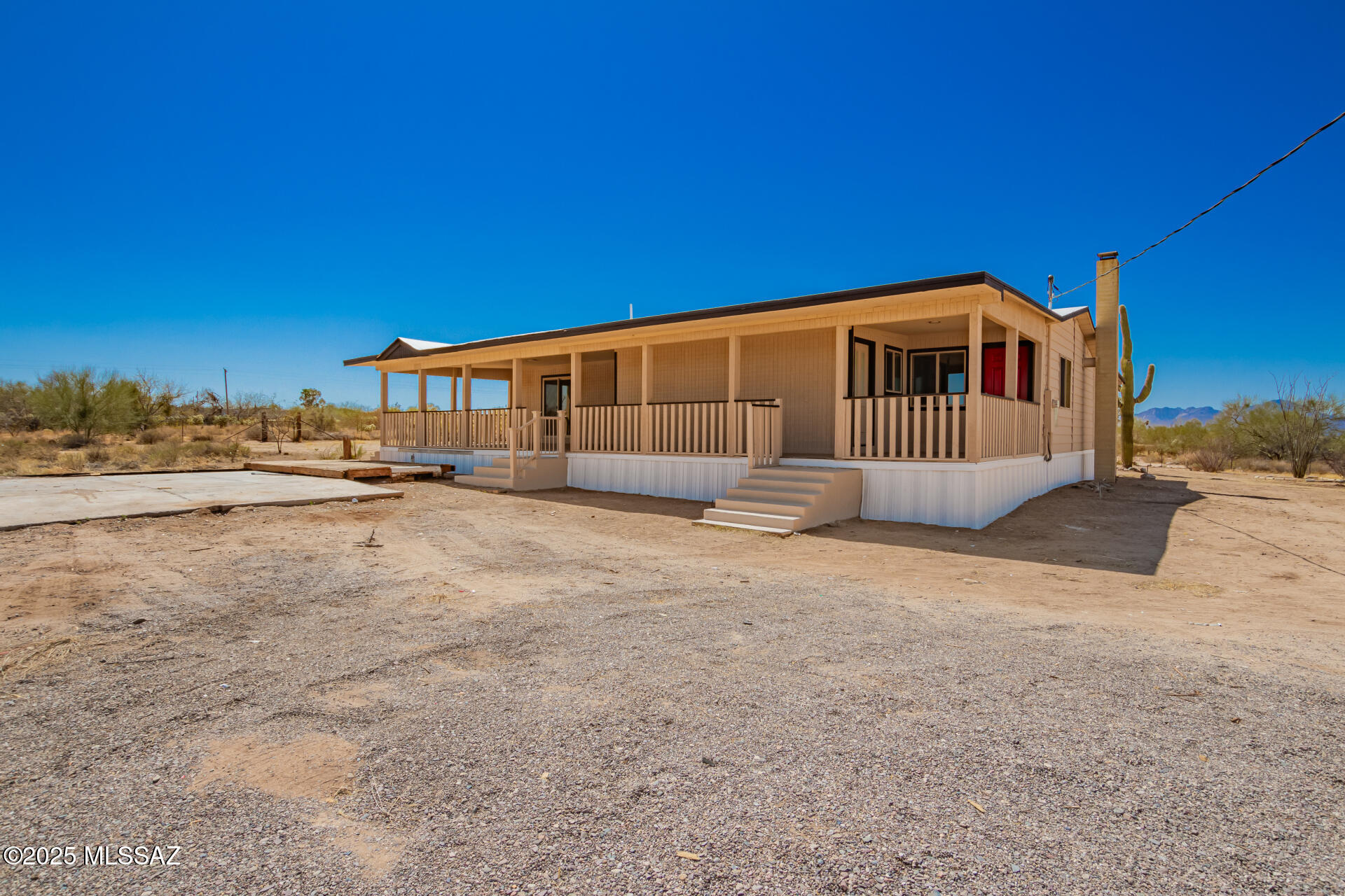 Spacious 3 bed, 3 full bath manufactured home offering 2,620 sq ft on approximately 4 acres of wide open Sonoran Desert land! Enjoy privacy, room to breathe, and stunning desert living with a back covered porch perfect for soaking in those Arizona sunsets. Recent upgrades include a new pressure tank, new water line, and new water filter & softener system -- quality water from day one. Endless possibilities for animals, hobbies, or wide open space. Two parcels included -- additional adjacent parcels available for separate purchase, contact listing agent for details. Don't miss this rare opportunity! for everyday living. Behind the scenes, the big-ticket upgrades are already done for you: a new well pressure tank, new water line from the well to the home, and a whole-house filtration system with reverse osmosis and water softener--delivering clean, high-quality water throughout.

This isn't just a remodel--it's a home that feels fresh, functional, and ready to be enjoyed from day one.