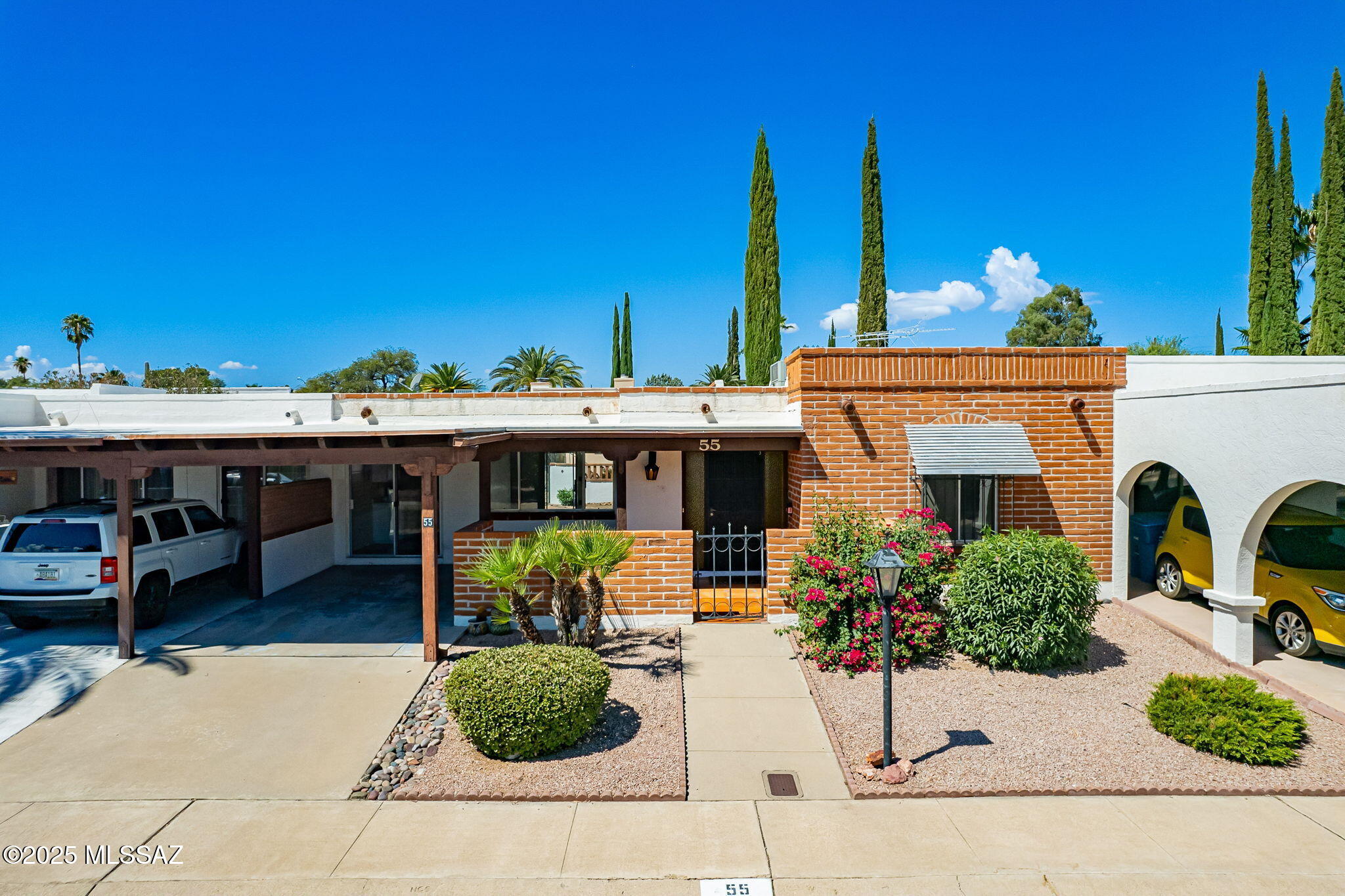 Located in coveted TH5 in the heart of Green Valley, this inviting 2BD/2BA 1,104 sf townhome is truly move-in ready! Recent improvements include fresh interior and exterior paint, new bedroom carpet, a 2023 HVAC system and a roof recoating completed in Oct 2025 for additional peace of mind. Recent plumbing updates include a new kitchen faucet, under-sink piping, new supply valves throughout the home (including W/D connections) and updated toilet internals in the guest bath. Electrical upgrades are currently being completed, including a new Eaton electrical panel and GFCI outlets. Stylish ceramic tile flows through the main living areas, while the tiled AZ Room also offers laundry and extra storage. Step outside to the tiled front patio or carport and enjoy the peekaboo mountain views. Enjoy the enclosed rear patio and backyard, perfect for outdoor relaxation or entertaining. A rear shed provides additional storage. Conveniently located near shopping, dining, golf, GVR amenities and medical offices, this updated, light and bright low-maintenance desert retreat is ready for its next owner.
