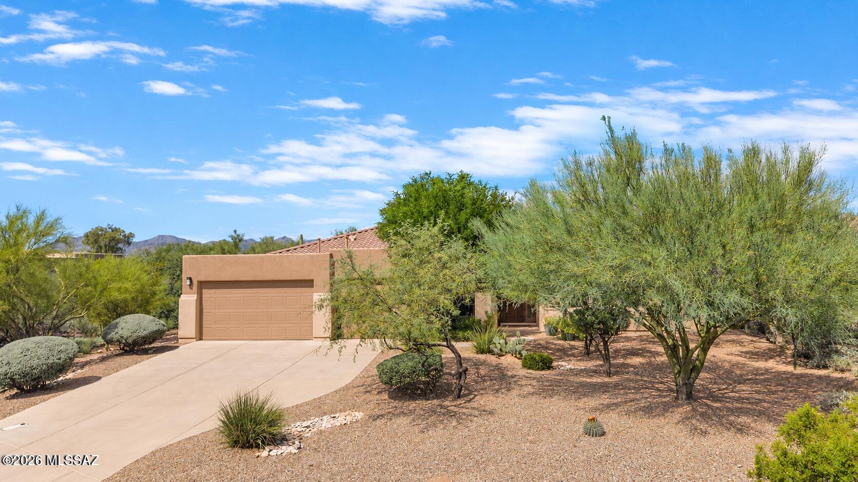 Highly desired Oro Valley gated neighborhood on over 1/2 acre of land which provides privacy in a semi-resort setting.  Surrounded by nature w/Catalina Mountain views. Home offers not only upgraded features but also a wonderful floor-plan layout. This 4 bedroom, 3 1/2 bath home has a separate living & formal dining areas. Spacious family room w/built-in entertainment center & fireplace is the perfect area to spend with others. Adjoining gourmet kitchen & dining area. From there you access the serene lush back yard featuring covered patio, fireplace and large seating area w/built in-BBQ station. The secluded master bedroom suite has access to patio + a stunning bathroom and walk in closet. The guest wing of the home offers 3 bedrooms, one with an en-suite private bathroom. Very lovely home! The 3 car garage is spacious and offers storage area.  Owners are licensed real estate brokers in Arizona - please acknowledge on purchase offer.
Winter time in the Sonoran Desert is a welcome escape from the cold, northern climates. Our sunny days and mild weather mean endless outdoor possibilities. In Oro Valley, we hike year-round. We golf year-round. We bicycle year-round. Some of us even wear shorts year-round! Leave the snow behind and come outside!
The Tucson region has turned into a mountain-biking mecca, and Oro Valley is the gateway to the best trails in the region. And hikers have no shortage of options at Catalina State Park. Additionally, the Town of Oro Valley has more than 50 miles of trails and paths set against the majestic Santa Catalina Mountains. 
While you're in town, be sure to try one of our great restaurants--some of which can only be found in Oro Valley!   
Whatever your tastes, Oro Valley has what you're looking for this winter season. And this gorgeous home on Portico Drive would be a great domicile to start your next adventure!