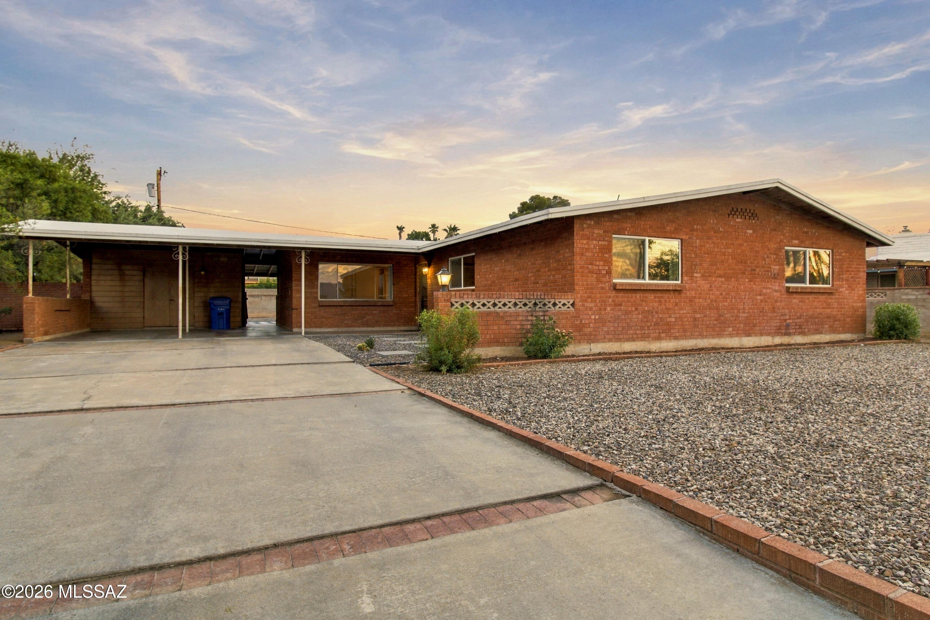 Welcome to this beautifully remodeled 3-bedroom, 2-bathroom home in central Tucson's desirable Duffy neighborhood. Step inside to an inviting living room that flows into a stylish, updated kitchen featuring stone countertops and refreshed cabinetry. Both bathrooms have been thoughtfully renovated with porcelain tile, modern vanities, and quartz countertops. Outside, enjoy a spacious backyard complete with a covered patio, pavers, and decorative gravel, creating the perfect setting for entertaining, family gatherings, or relaxing under the Arizona sky. Meticulously maintained and move-in ready, this charming home offers comfort, style, and convenience in a sought-after Tucson location.