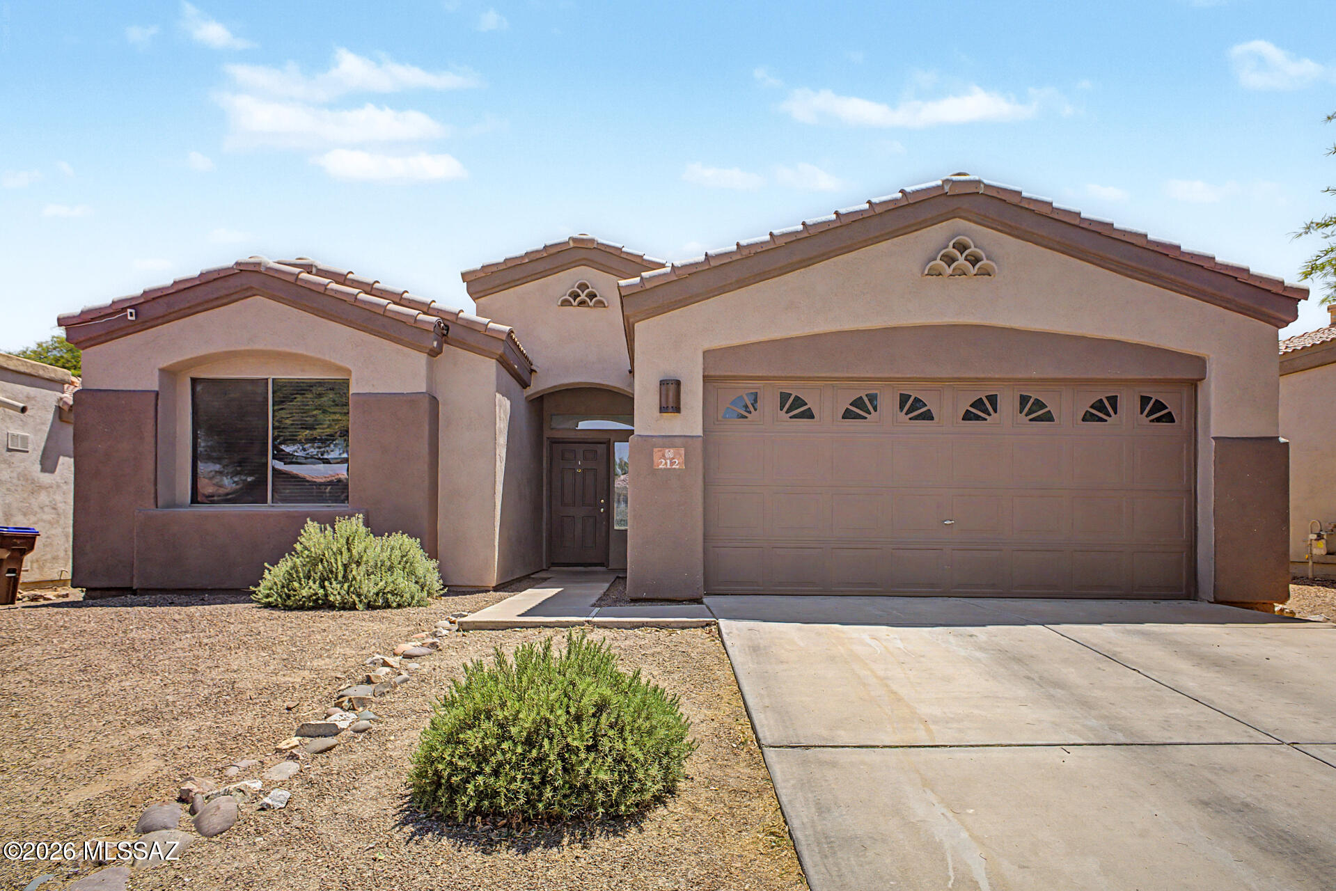 ***Assumable VA Loan at 3.125%*** Welcome to this beautifully maintained 3-bedroom, 2-bathroom single-family home located in a gated community within the highly desirable Rancho Sahuarita. Built in 2003, this spacious 1,776 sq ft residence offers comfort, functionality, and modern touches throughout.

Step inside to discover soaring high ceilings and an open-concept layout that creates a bright and inviting atmosphere. The great room features a cozy gas fireplace--perfect for relaxing evenings or entertaining guests. The spacious kitchen is includes granite countertops, a center island, stainless steel appliances, and a gas range, offering plenty of room for cooking and gathering. The expansive primary suite provides a peaceful retreat with ample space and a luxurious ensuite bathroom featuring dual vanity sinks, a separate soaking tub and walk-in shower, and not one, but two walk-in closets. Two additional bedrooms offer flexibility for family, guests, or a home office.

Additional highlights include a 2-car garage and a washer and dryer included for added convenience.

Enjoy all the amenities that Rancho Sahuarita has to offer--a vibrant master-planned community with multiple pools, scenic parks, walking trails, a beautiful lake, and a full recreation center, and so much more.

This home combines comfort, style, and access to an incredible community--don't miss the opportunity to make it yours!