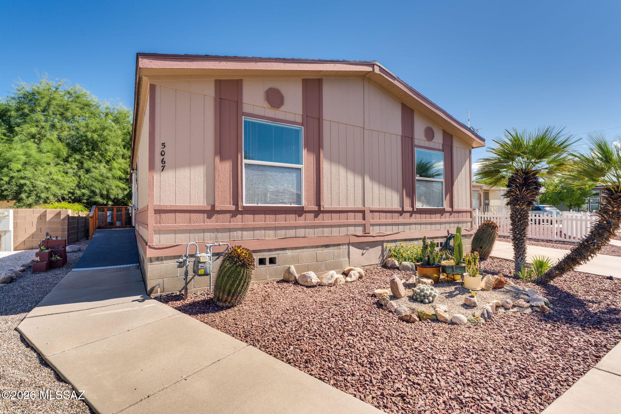 Nestled in a cozy community, this home offers 3 bedrooms & 2 bathrooms in 1344 sq.ft. on a desirable cul-de-sac lot. You can enjoy generous living space with the open-concept floor plan, large dining room, & breakfast bar. Both front & backyards are low maintenance with decorative gravel & native desert shrubs. There is a 1-car attached carport with additional parking in the drive way.