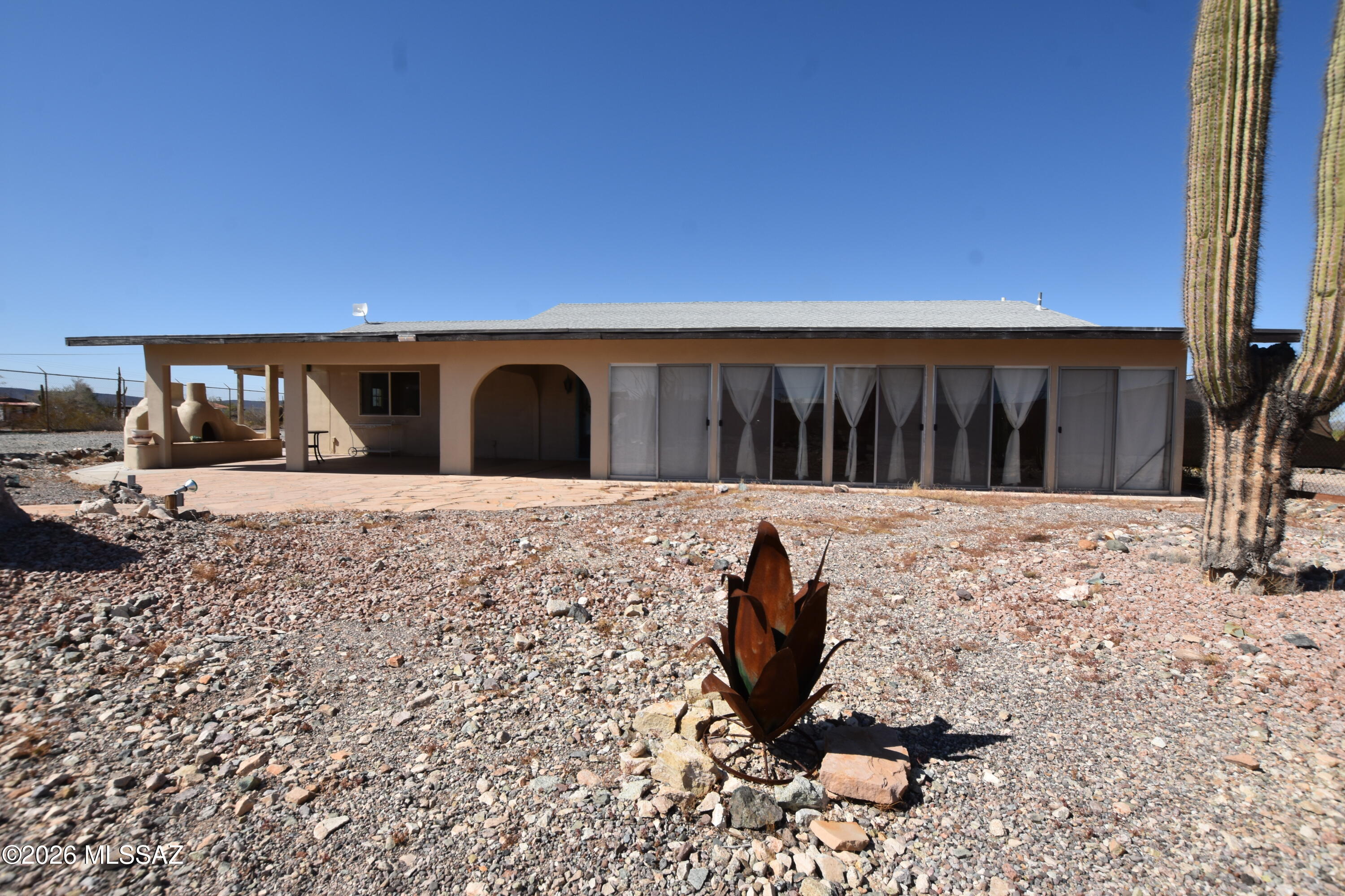 Tucked away in a charming desert community in southwestern Arizona, this inviting 3-bedroom, 2-bath home with separate garage captures the essence of relaxed, small-town living with a rich past. Once a thriving hub during the days of the copper mining boom, the town has evolved into a warm, welcoming destination known for its seasonal energy and strong sense of community. Situated on over three acres of premium property, this residence offers a rare blend of privacy, functionality, and opportunity. The expansive land provides ample space for equestrian use, RV storage, additional structures, or income-producing possibilities such as rentals or boarding. Surrounded by sweeping desert state land views and open skies, the home is ideal as a peaceful retreat. The town comes alive in the Winter months, attracting visitors who enjoy weekly markets, art shows, outdoor recreation, and a laid-back lifestyle.
Whether you're seeking a full-time residence, seasonal escape, or investment opportunity, this property offers space, charm, and endless potential.