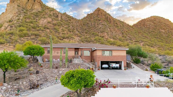 *SELLER IS WILLING TO ACCEPT OFFERS BETWEEN $720,000 AND $750,000 WITH A REACHABLE PRICE AGREEMENT* MOTIVATED SELLER     Experience comfort and beautiful mountain views in this spacious 4-bedroom home! Features include mature landscaping, an inviting front patio, 2-car garage, tile flooring, vaulted ceilings, abundant natural light, and multiple living areas, including a sunken living room and cozy family room with fireplace. The kitchen offers plenty of cabinetry, a breakfast bar, and stainless steel appliances. The owner's suite includes a sitting area, full bath with separate shower/tub, and sauna. The backyard is perfect for year-round enjoyment. with a covered patio perfect for relaxation and a sparkling pool for a refreshing time, accompanied by the breathtaking scenery! Make this gem yours now!