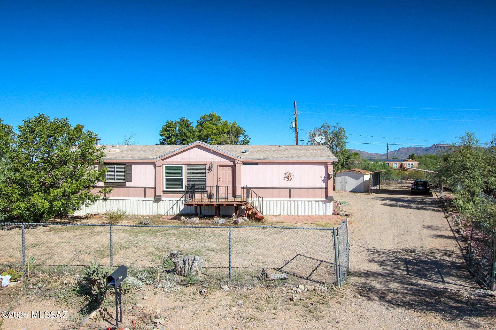 Don't miss this beautifully maintained 3BR/2BA home in Tucson! Split floor plan offers privacy, with spacious living room and cozy family room featuring a natural fireplace. Located at the end of a quiet road backing to state land for added privacy and views. Fully fenced, landscaped lot with mature trees, 10x38 covered patio, 2-car carport & room for RVs or toys. No HOA!