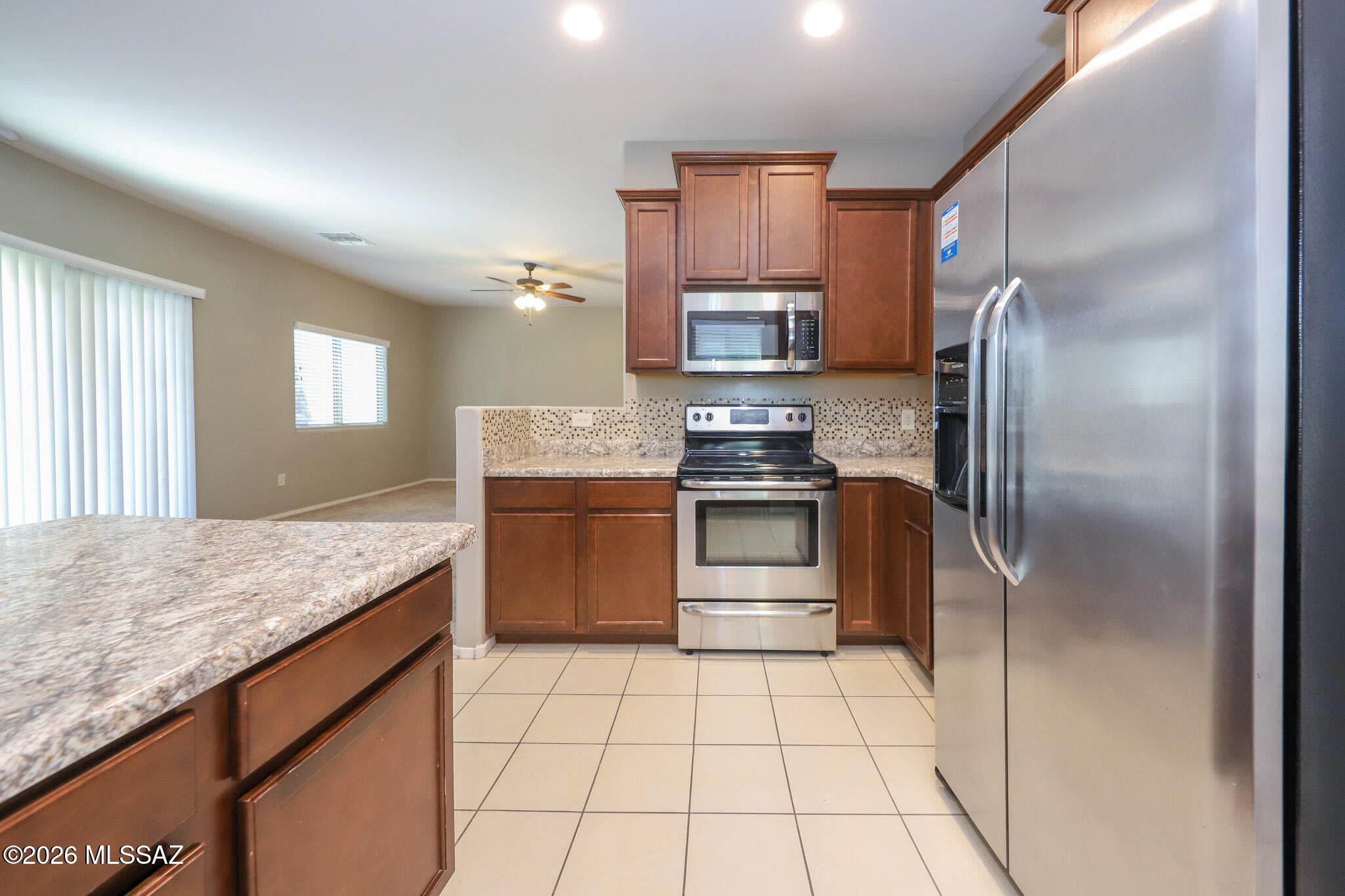 Beautiful two-story home in a highly desirable gated community on Tucson's northwest side. Ideally located near I-10 and the Cortaro Corridor, you'll enjoy easy access to shopping, dining, golf courses, parks, schools, and everyday conveniences.

This spacious home features 4 large bedrooms, a den/home office, and an upstairs family room, offering plenty of space for work, relaxation, and entertaining. The convenient upstairs laundry room includes a newer washer and dryer.

The open-concept kitchen is equipped with dark cabinetry, granite-look countertops, a large pantry, reverse osmosis water filtration, and newer appliances, including a refrigerator, dishwasher, electric range, oven, and microwave.
