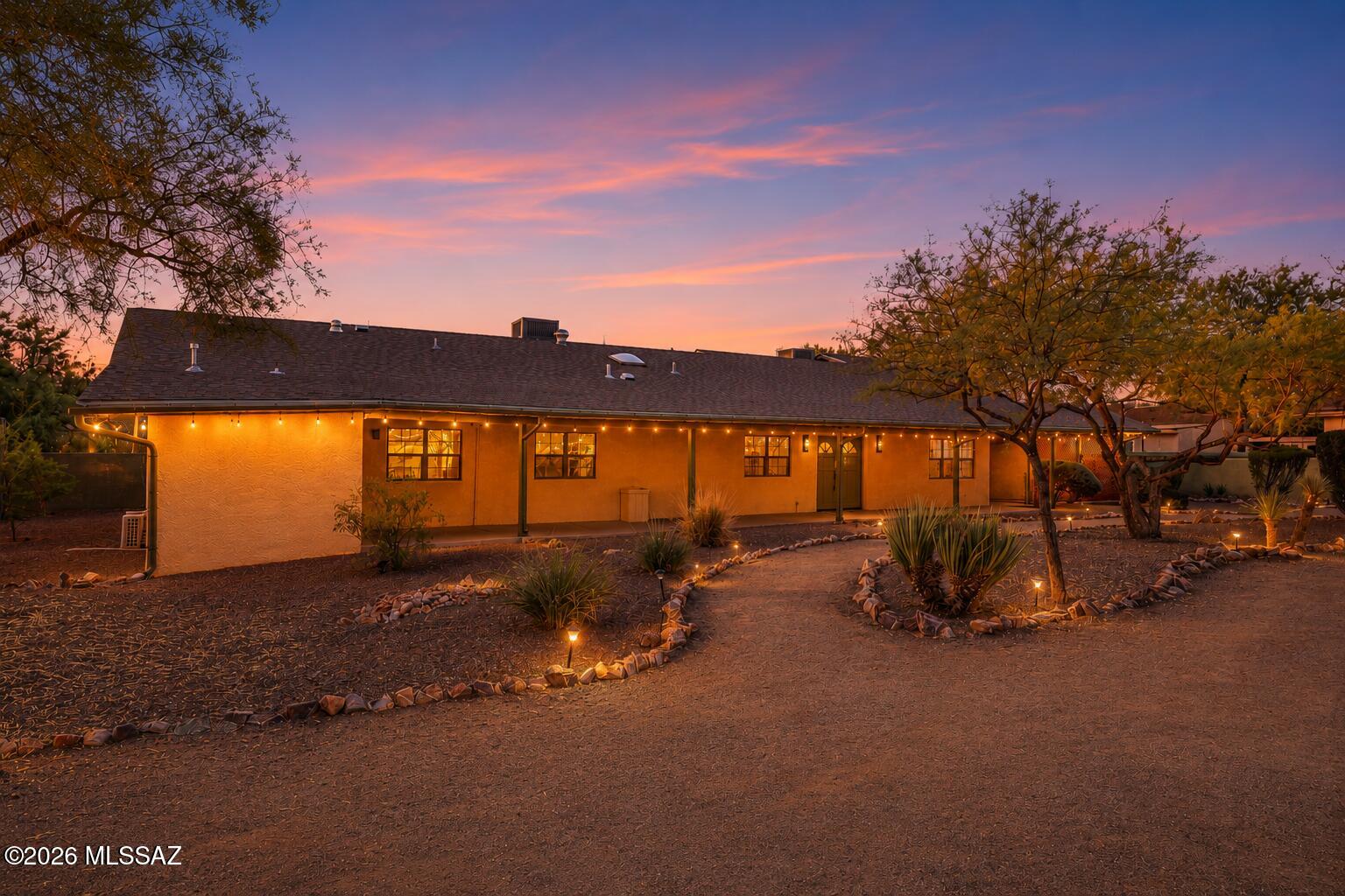 Welcome Home! Set on an exceptionally spacious lot in the heart of Midtown Tucson, 4537 E San Carlos Place is a soulful, one-of-a-kind retreat where timeless character, thoughtful renovation and incredible flexibility come together. Lovingly improved and meticulously cared for, this expansive property provides room to gather, create, host, work and play--all in a central location convenient to Tucson Medical Center, the University of Arizona, shopping, dining and the very best of the city.

Inside the main residence, warm natural materials and custom craftsmanship give every room a sense of authenticity. Rich cherry cabinetry carries throughout much of the home, complemented by polished granite, soft-close storage, real wood accents and a distinctive copper-finished kitchen counter that feels more like functional art than an ordinary surface. Skylights, custom artistic doors and original architectural details add personality, while an inviting, single-level layout offers comfort and ease!

The private primary retreat is especially distinctive, with dual bathrooms--a wonderfully practical arrangement that may be the secret to domestic harmony--along with a beautifully designed dressing room featuring custom cabinetry, illuminated vanity drawers and generous double-hanging storage. Flexible secondary rooms can accommodate bedrooms, offices, creative studios or quiet spaces for guests.

Beyond the main residence, a fully equipped guest house creates an extraordinary second living environment with its own kitchen, bathroom, laundry, ground-level sleeping area and an airy upstairs office or convertible guest space. Ideal for multigenerational living, a private professional suite or income potential, it has previously attracted traveling professionals and offers meaningful separation without sacrificing connection.

Outdoors, the possibilities become even more exciting. Multiple covered patios invite year-round dining and relaxed evenings beneath the desert sky, while an outdoor cooking area, mature landscaping, mountain views and intimate garden spaces create a setting that feels private, peaceful and unexpectedly removed from the city around it!

At the heart of the oversized grounds is a full-size sport court--a rare amenity for tennis, pickleball, basketball, soccer practice or an unforgettable recreation space for all!

Major improvements provide valuable peace of mind, including a roof completed in 2024, HVAC replacements between 2022 and 2024, newer water heaters, updated exterior areas and extensive interior plaster and paint refreshing. The home reflects unmistakable pride of ownership, with years of attentive stewardship evident throughout!

Distinctive, flexible and filled with warmth, 4537 E San Carlos Place is not a cookie-cutter Midtown home. It is a private compound for people who value character, independence and the freedom to live life on a larger scale!
