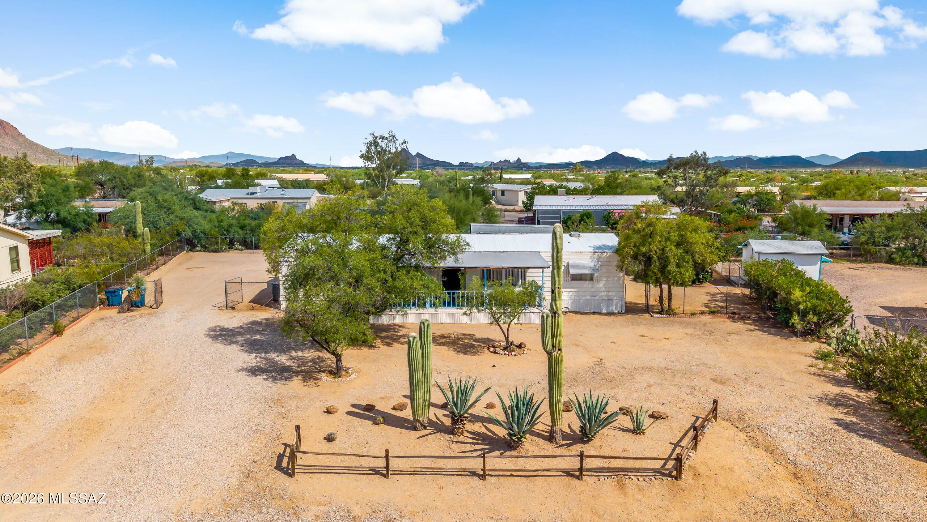 Enjoy beautiful Arizona sunsets and mountain views from this Harmon MH situated on approximately half an acre. This 3-bedroom, 2-bath home offers 1,530 sq. ft. of living space and is connected to city water, sewer, gas, and electric. The property also features RV hookups, covered parking, and plenty of outdoor space to enjoy the surrounding desert scenery. While the home is ready for a buyer's personal updates and improvements, it offers great potential to make it your own with some fix up. All appliances convey with the sale as a bonus. This property is a must-see for buyers or investors looking for a home that has plenty of possibilities at an affordable price!