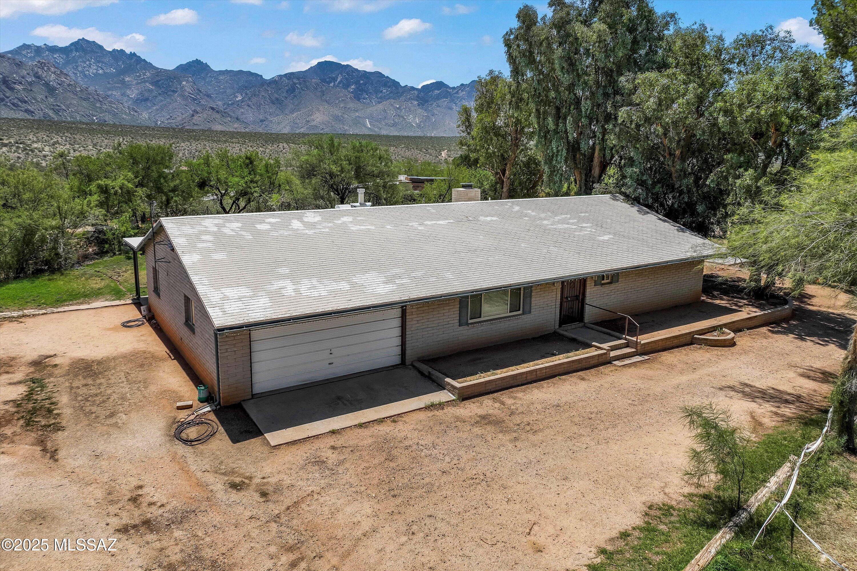 Horse Property with Stunning Views in Catalina! Welcome to your desert retreat on 2.77 acres in beautiful Catalina! This 3 bedroom, 2.5 bath home offers room to roam both inside and out. The heart of the home is a spacious great room just off the kitchen, complete with a cozy wood-burning fireplace perfect for chilly desert evenings. The kitchen features ample cabinet and counter space, making meal prep a breeze. You'll also love the additional living room with custom built-in shelves ideal for a home office, reading nook, or media space. Step outside and take in the breathtaking mountain views. Horse lovers will appreciate the existing shelter structures (some to convey), and there's plenty of space to expand your equestrian dreams. Whether you're looking for peaceful solitude or room to grow, this property offers endless potential.
Don't miss your chance to own a slice of Southern Arizona paradise schedule your private showing today!