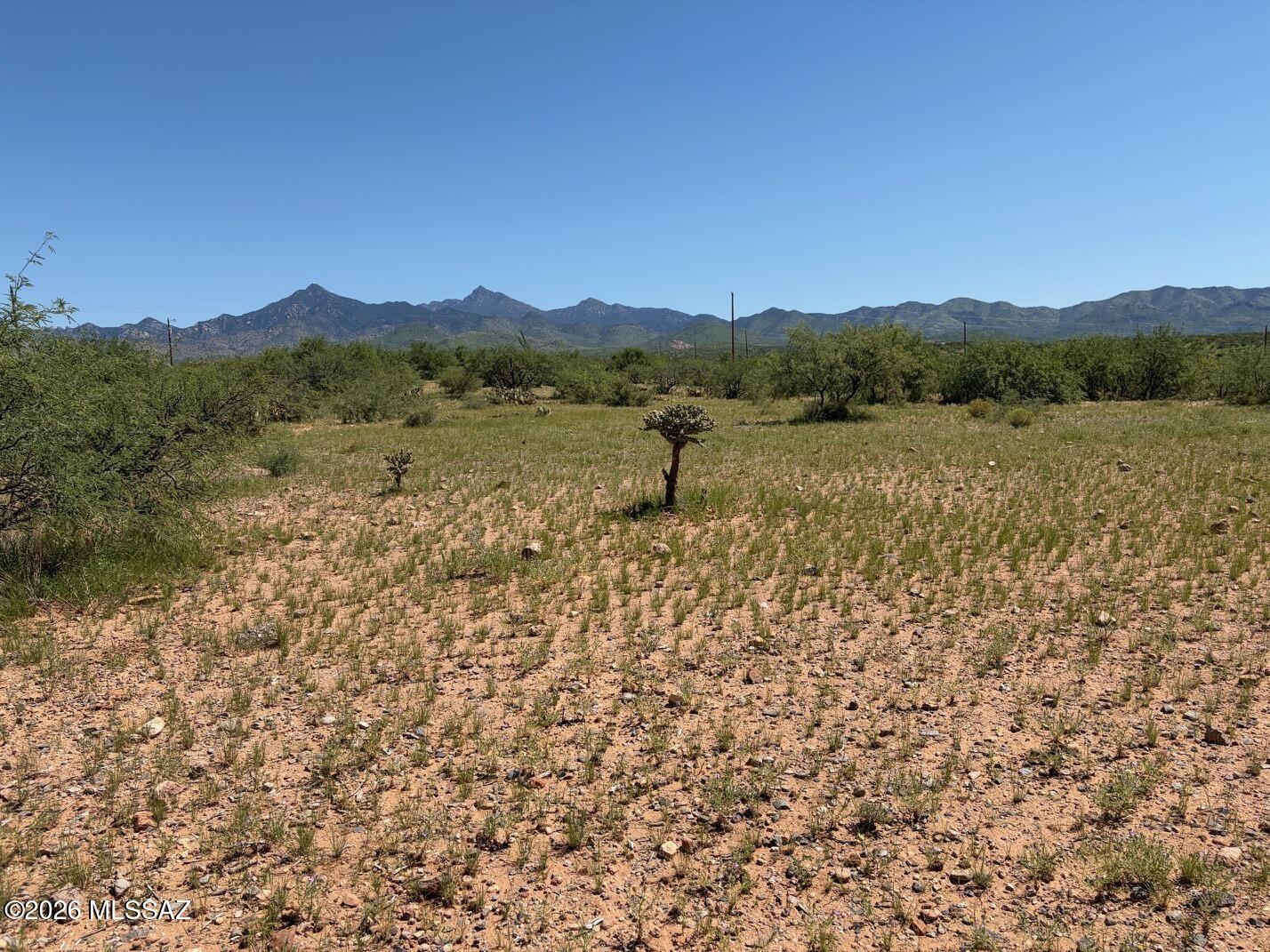 Corner lot in desirable Northeast Rio Rico area with wide open views to the Santa Rita Mountains to the east. Level terrain with passing percolation test 2019.  From this lot, enjoy magnificent sunrise and sunset views.