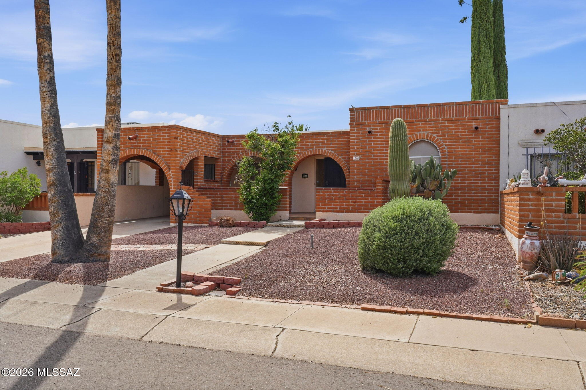 2-bedroom, 2-bath single-level townhome in a highly convenient Green Valley location across from Esperanza Shopping Center, featuring a new AC system installed in 2025.

Functional layout with an open great room, skylit kitchen with breakfast bar, and dining area with access to the covered front patio and carport. An enclosed Arizona Room provides additional usable space for a home office, hobby area, or sitting room.

The primary suite includes an en-suite bath with walk-in shower. Guest bedroom and full bath offer separation for visitors.

Low-care desert landscaping and easy access to I-19, shopping, dining, and everyday services make this a practical option for full-time or seasonal living. Located in the Green Valley Recreation (GVR) service area, with access to pools, fitness centers, pickleball, golf, and community amenities.