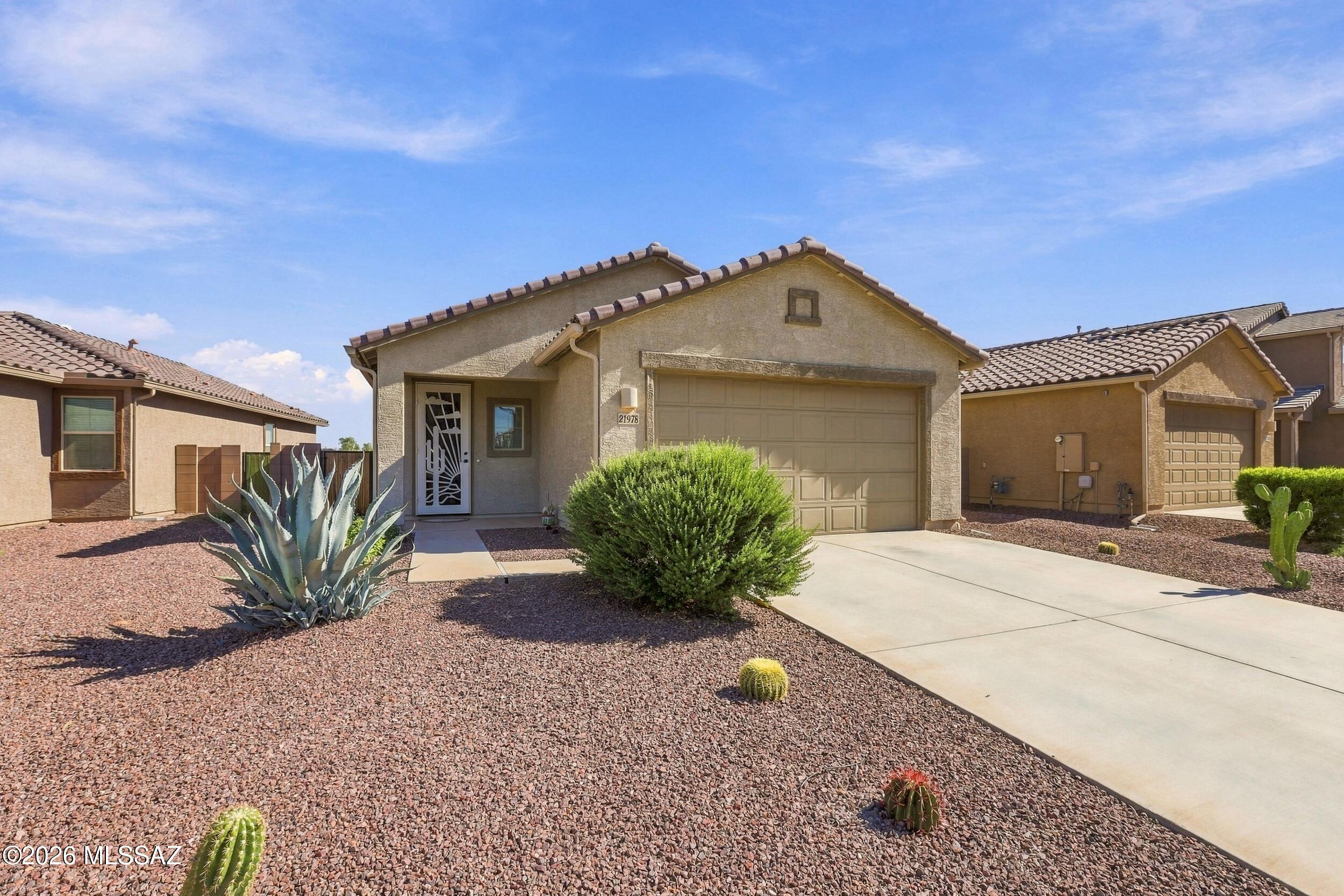 Welcome to this beautiful 4 bedroom, 2 bathroom home in Red Rock, built in 2022! This thoughtfully designed home offers modern living with a functional floor plan and plenty of space for everyday living and entertaining. One of the standout features is the backyard location--this home backs directly to the neighborhood park, providing a peaceful view and added sense of openness with no home immediately behind you. Enjoy relaxing in the backyard while taking in the park views. You can also enjoy the community amenities, including a swimming pool, splash pad, playground, skate park, basketball court, and baseball field!